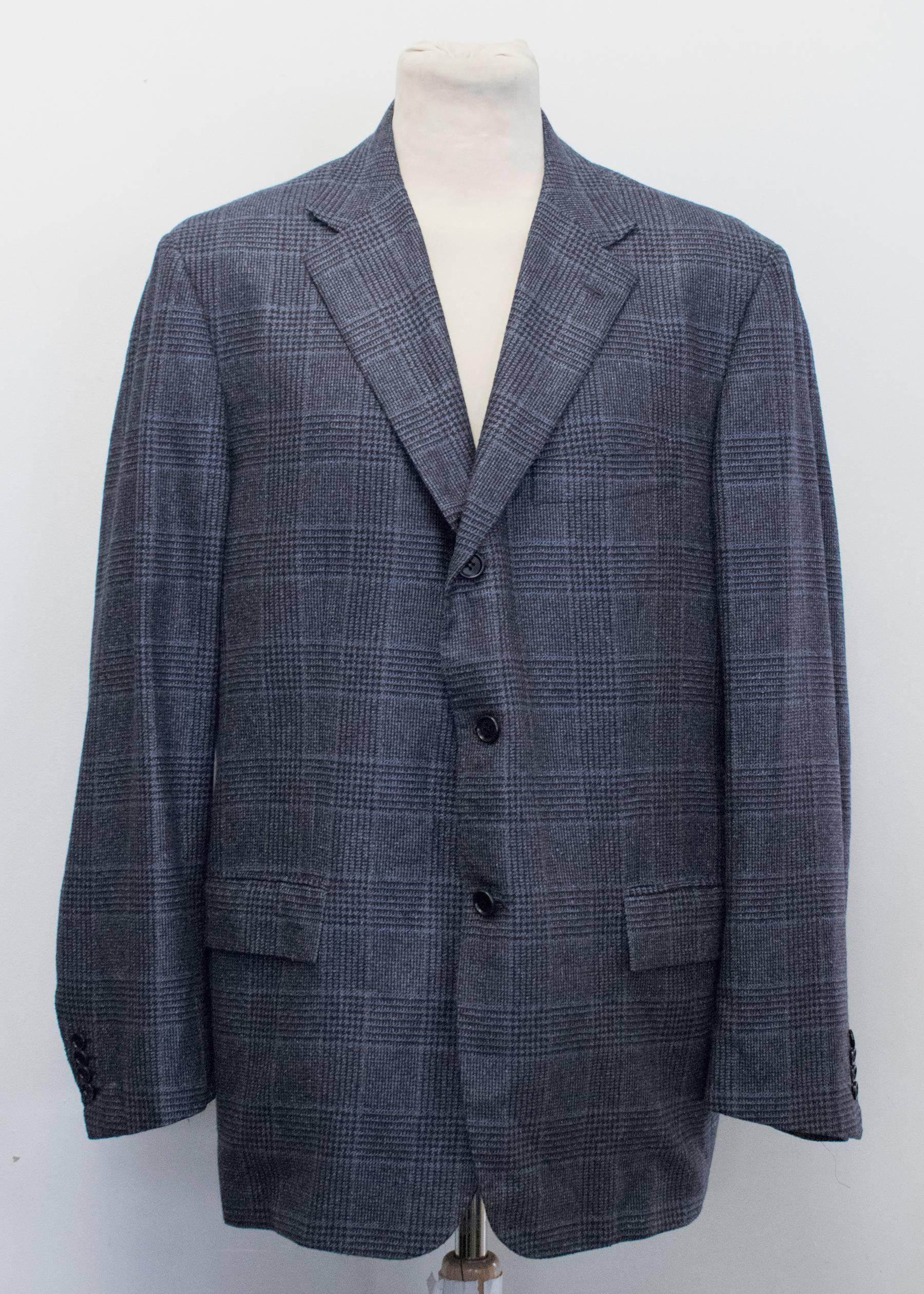 Kiton for Jean Jacques blue and black checked jacket. Shoulder pads. Notch lapels. Two functional flap pockets on the front. Two interior pockets with button enclosure. Three buttons down the centre. Medium weight. 

Condition: 10/10

Measurements: