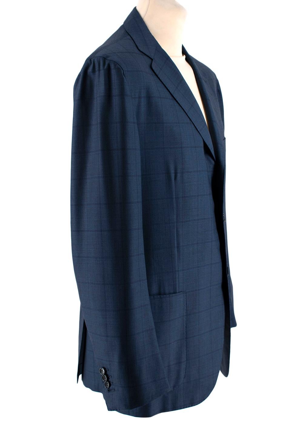 Kiton Napoli Blue Checkered Wool Single Breasted Suit

- Made of soft lightweight wool
- Gorgeous blue checkered pattern 
Jacket:
- Three exterior pockets
- Three interior pockets
- Single-breasted cut with three button enclosures
- Four buttons on