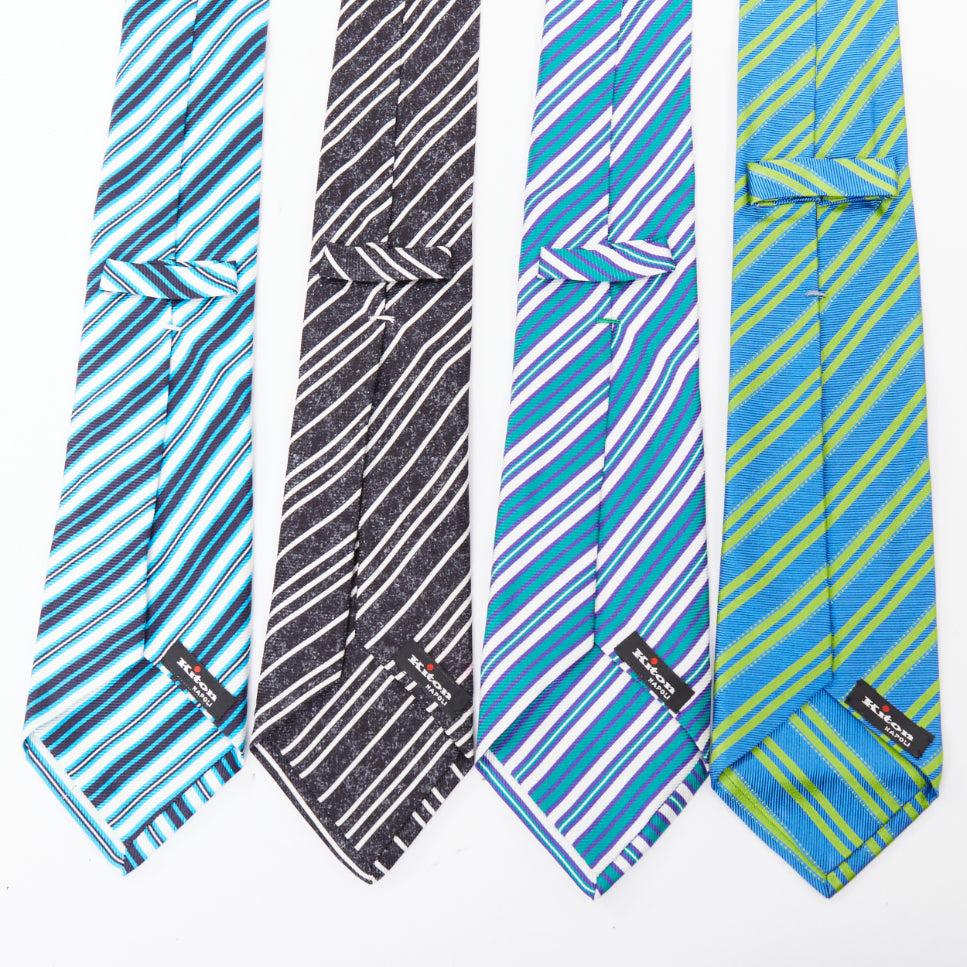KITON NAPOLI Set di 4 cravatte da abito in 100% seta blu verde nero bianco a righe diagonali
Riferimento: TGAS/F00053
Marchio: KITON
Materiale: Seta
Colore: Multicolore
Modello: A righe
Prodotto in: Italia

CONDIZIONE:
Condizioni: Eccellente, questo