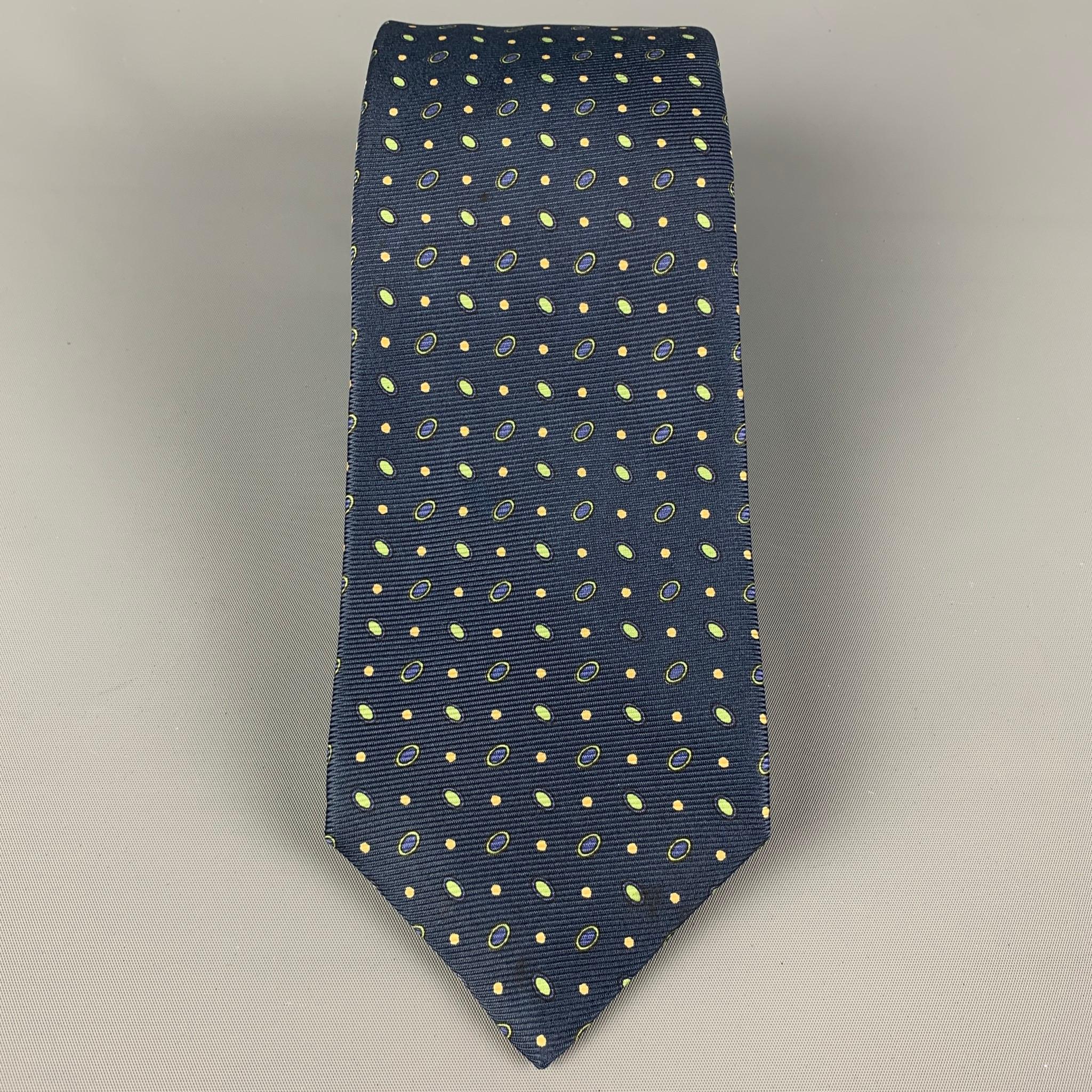 KITON necktie comes in a navy & green silk with a all over dot print. Made in Italy .

Very Good Pre-Owned Condition.

Width: 3.75 in.
Length: 62 in. 

 