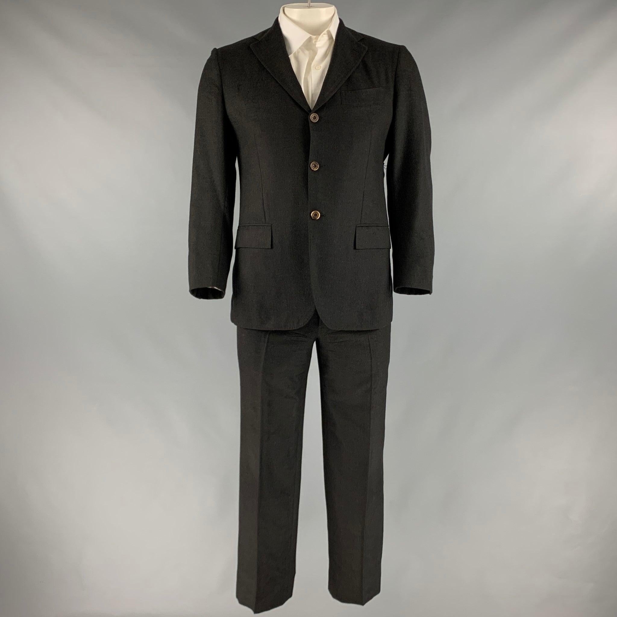 KITON for WILKES BASHFORD suit
in a grey cashmere with a full liner and includes a single breasted, three button sport coat with notch lapel and matching flat front trousers.Very Good Pre-Owned Condition. Custom made, as is. 

Marked:   45