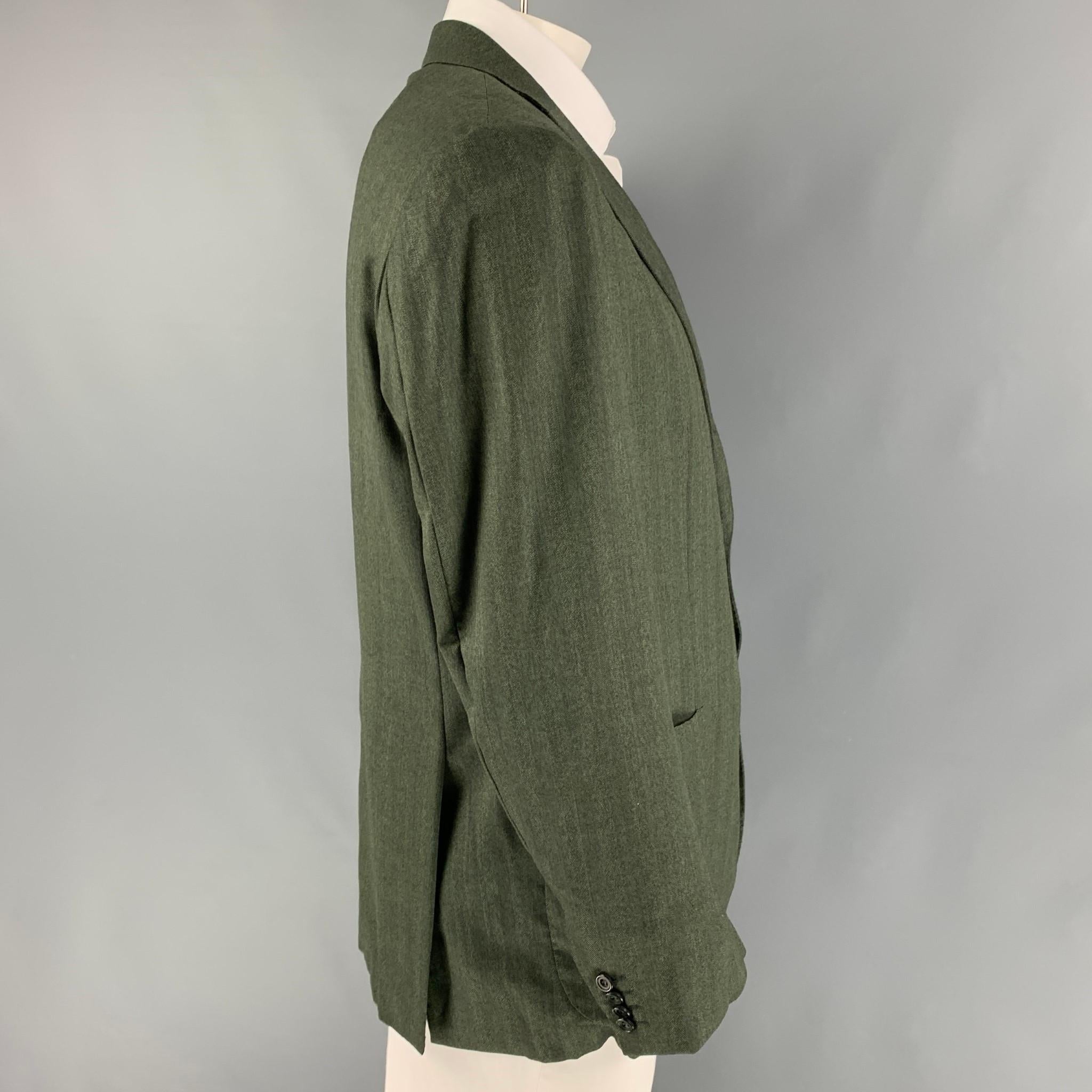 KITON sport coat comes in a green herringbone wool with a full liner featuring a notch lapel, patch pockets, double back vent, and a three button closure. 

Very Good Pre-Owned Condition.
Marked: 54

Measurements:

Shoulder: 19 in.
Chest: 44