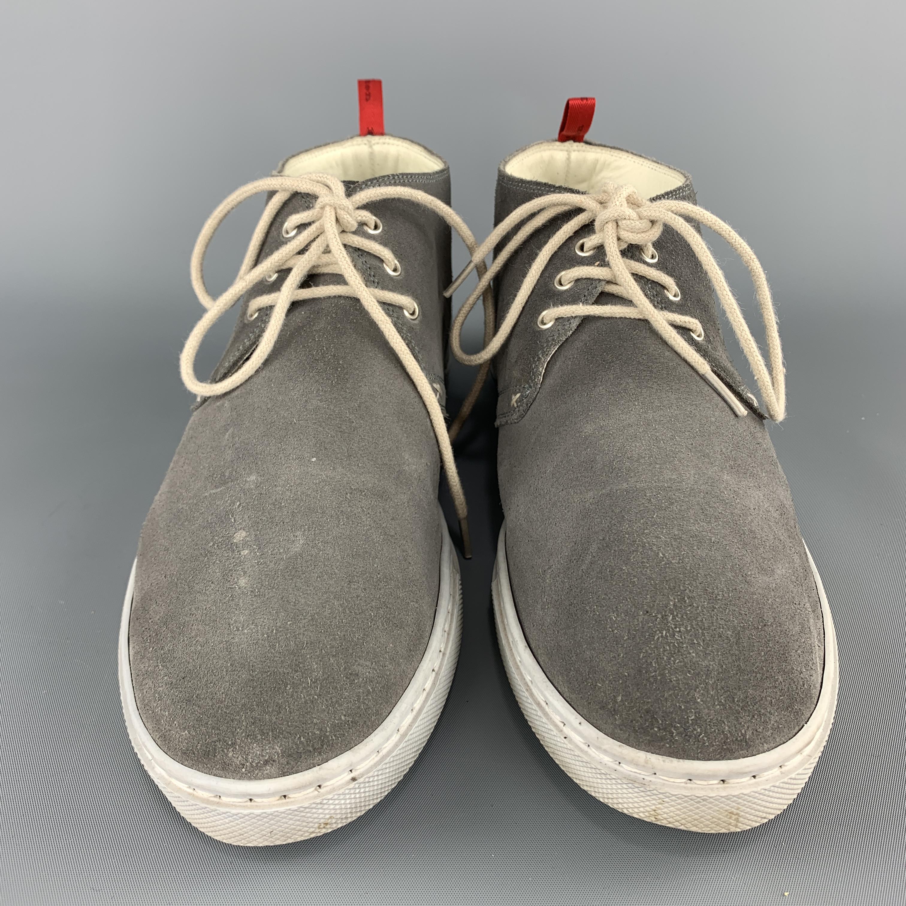 KITON chukka boots sneakers come in dark gray suede with light gray rubber soles. Wear throughout. 

Good Pre-Owned Condition.
Marked: UK 7

Outsole: 11 x 3.75 in.