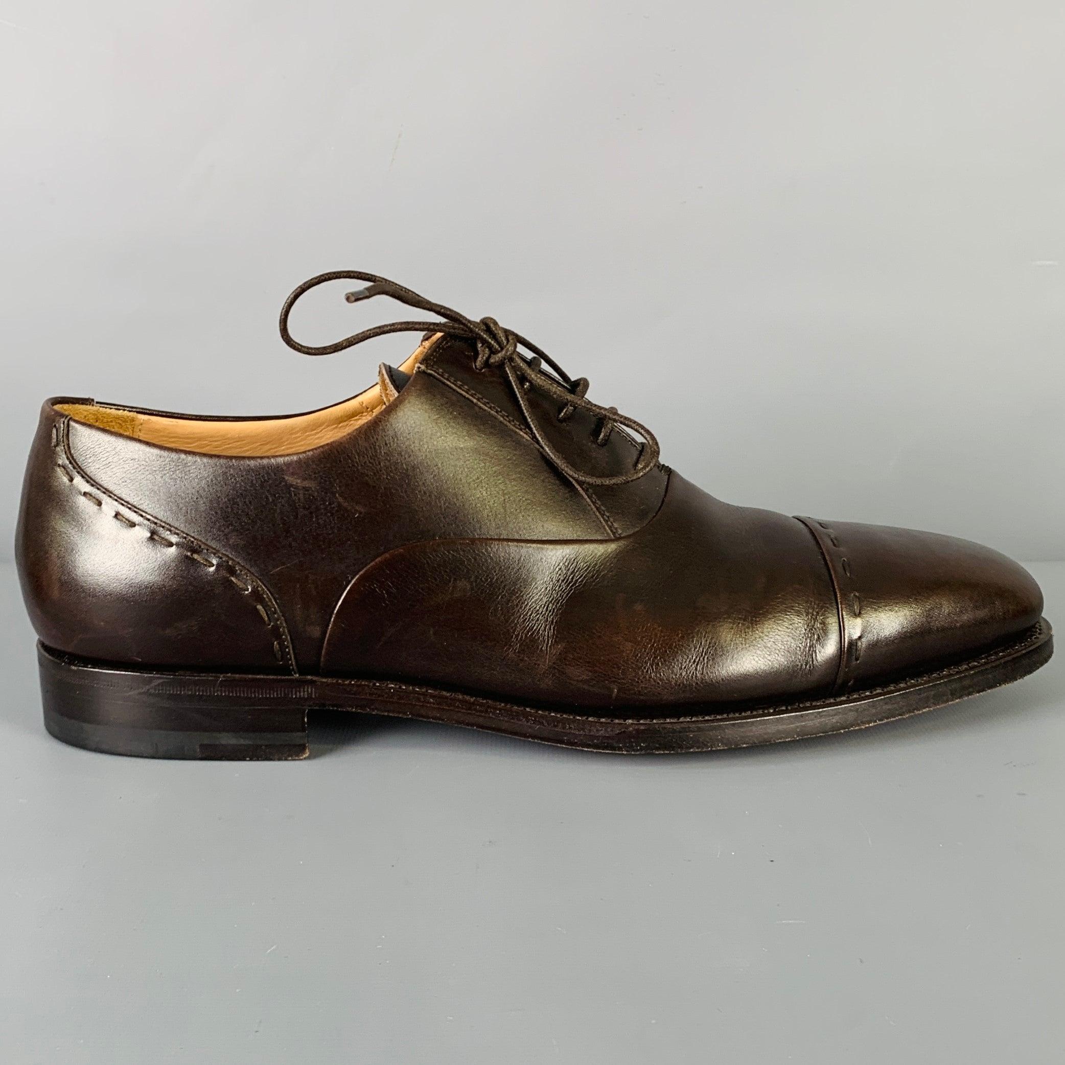 KITON dress shoes
in a brown leather featuring an oxford style, cap toe, and lace-up closure. Handmade in Italy. Very Good Pre-Owned Condition. Minor signs of wear. 

Marked:   8.5Outsole: 11.75 inches  x 4 inches 
  
  
 
Sui Generis Reference: