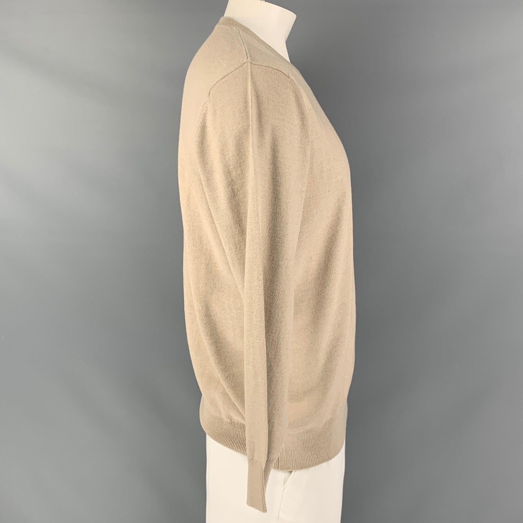 KITON pullover comes in a beige cashmere and silk knit featuring ribbed hem, and a V-neck. Made in Italy.Excellent Pre-Owned Condition. 

Marked:   L/ 52 

Measurements: 
 
Shoulder: 19 inches Chest: 48 inches Sleeve: 26 inches Length: 28.5 inches
