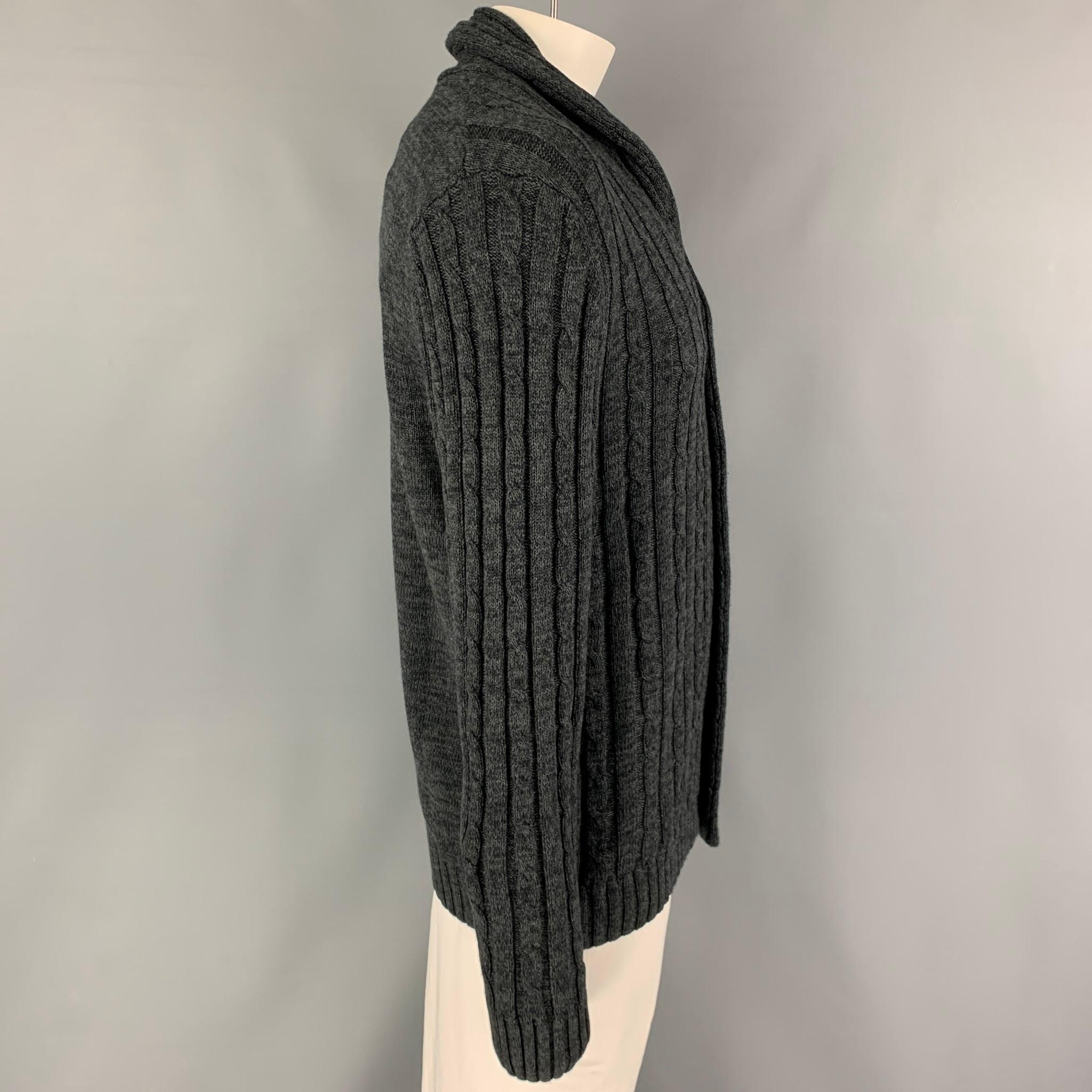 KITON cardigan comes in a grey knitted cotton featuring a shawl collar and a logo buttoned closure. Made in Italy.

New with tags. 
Marked: L/52

Measurements:

Shoulder: 18 in.
Chest: 42 in.
Sleeve: 29 in.
Length: 31 in.
