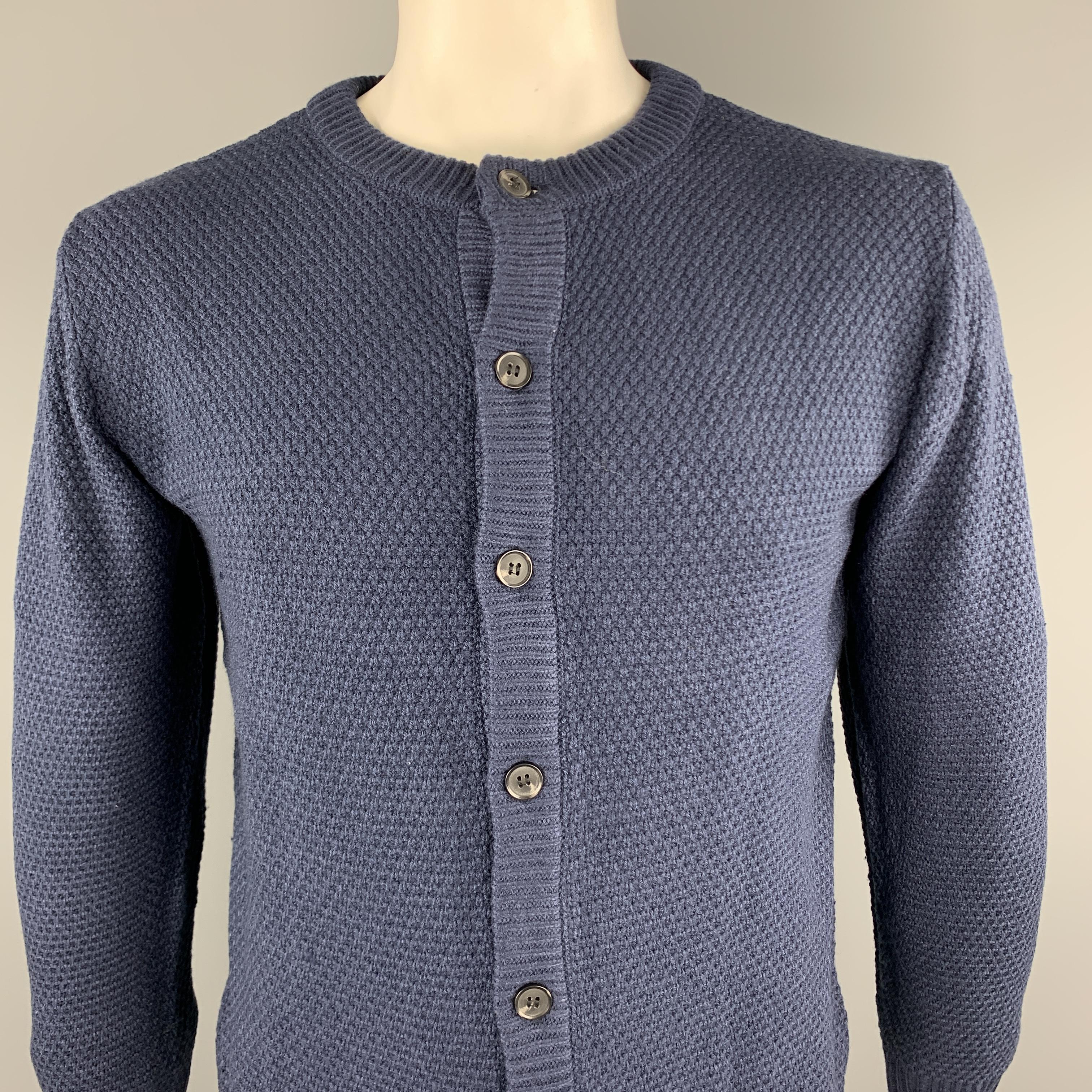 KITON cardigan sweater comes in a solid navy textured cotton material, with a ribbed collar, cuffs and hem, and a buttoned front. Made in Italy. 

New With Tags.
Marked: IT 52 / US L

Measurements:

Shoulder: 18.5 in.
Chest: 44 in.
Sleeve: 24 in.