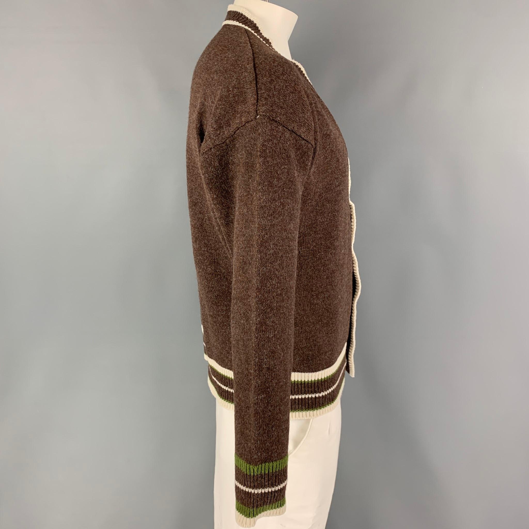 KITON cardigan comes in a brown knitted cotton featuring a cream contrast trim and a buttoned closure. Made in Italy. 

New with tags. 
Marked: M/50

Measurements:

Shoulder: 24 in.
Chest: 46 in.
Sleeve: 23 in.
Length: 27 in.