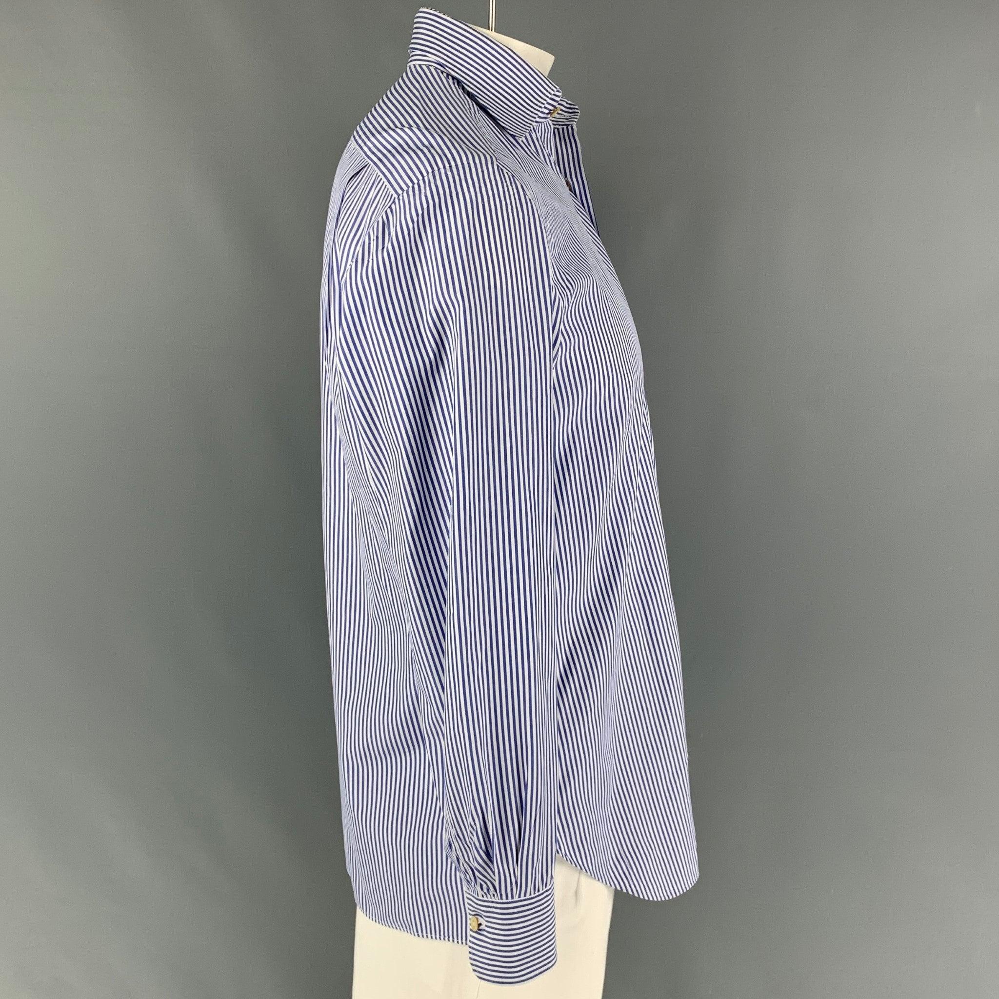 KITON long sleeve shirt comes in a white & navy stripe cotton featuring a spread collar, patch pocket, and a button up closure. Made in Italy.
Very Good
Pre-Owned Condition.  

Marked:   15.5/39 

Measurements: 
 
Shoulder: 19.5 inches  Chest: 44