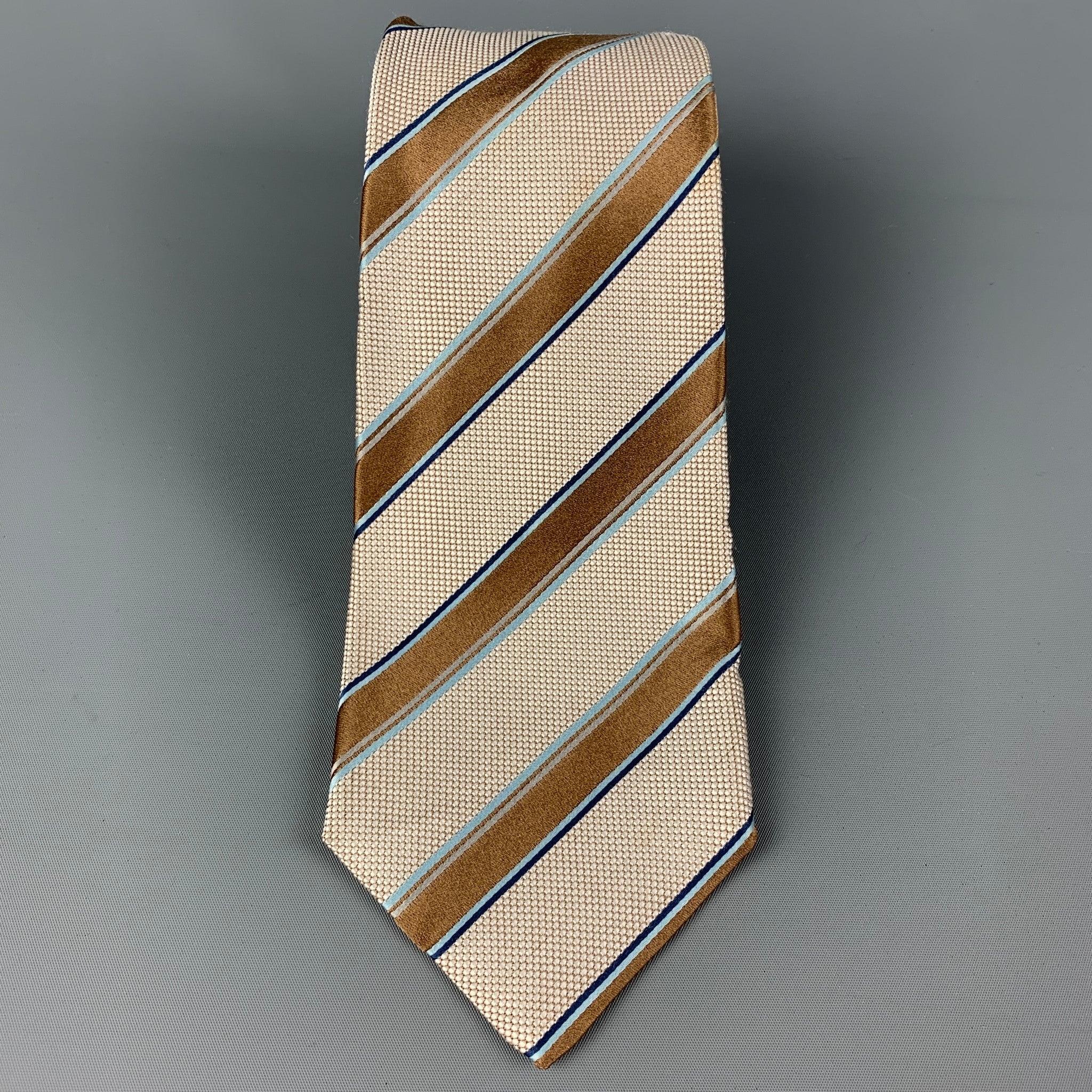 KITON necktie comes in a tan & white silk with a all over diagonal stripe print. Made in Italy . Very Good Pre-Owned Condition.Width: 3.75 inches Length: 61 inches 
 

 

  
  
  
 Sui Generis Reference: 120374
 Category: Tie
 More Details
  
