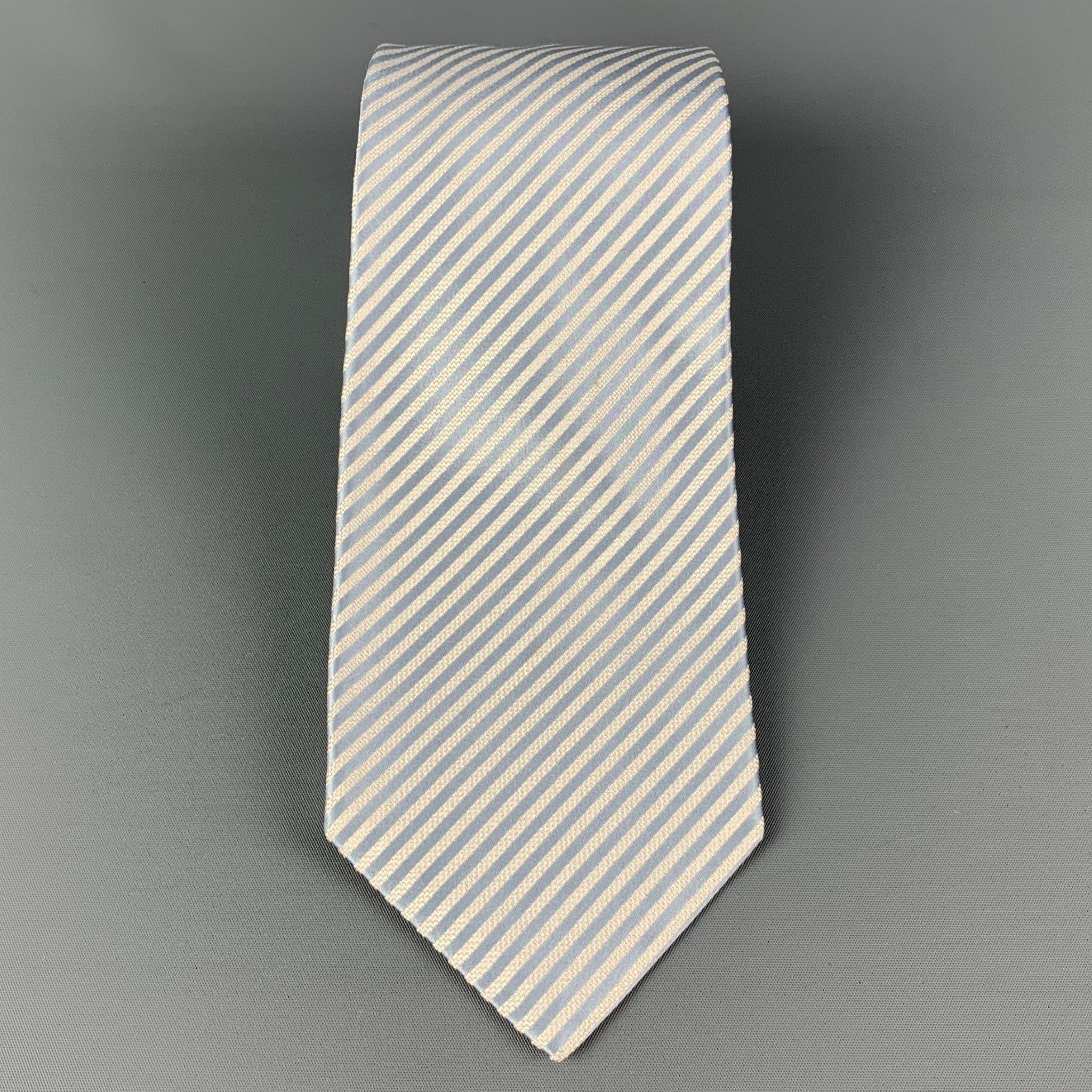 KITON necktie comes in a light blue & white silk with a all over diagonal stripe print. Made in Italy . Very Good Pre-Owned Condition.Width: 3.75 inches Length: 61 inches 
 

 

  
  
  
 Sui Generis Reference: 120383
 Category: Tie
 More Details
 