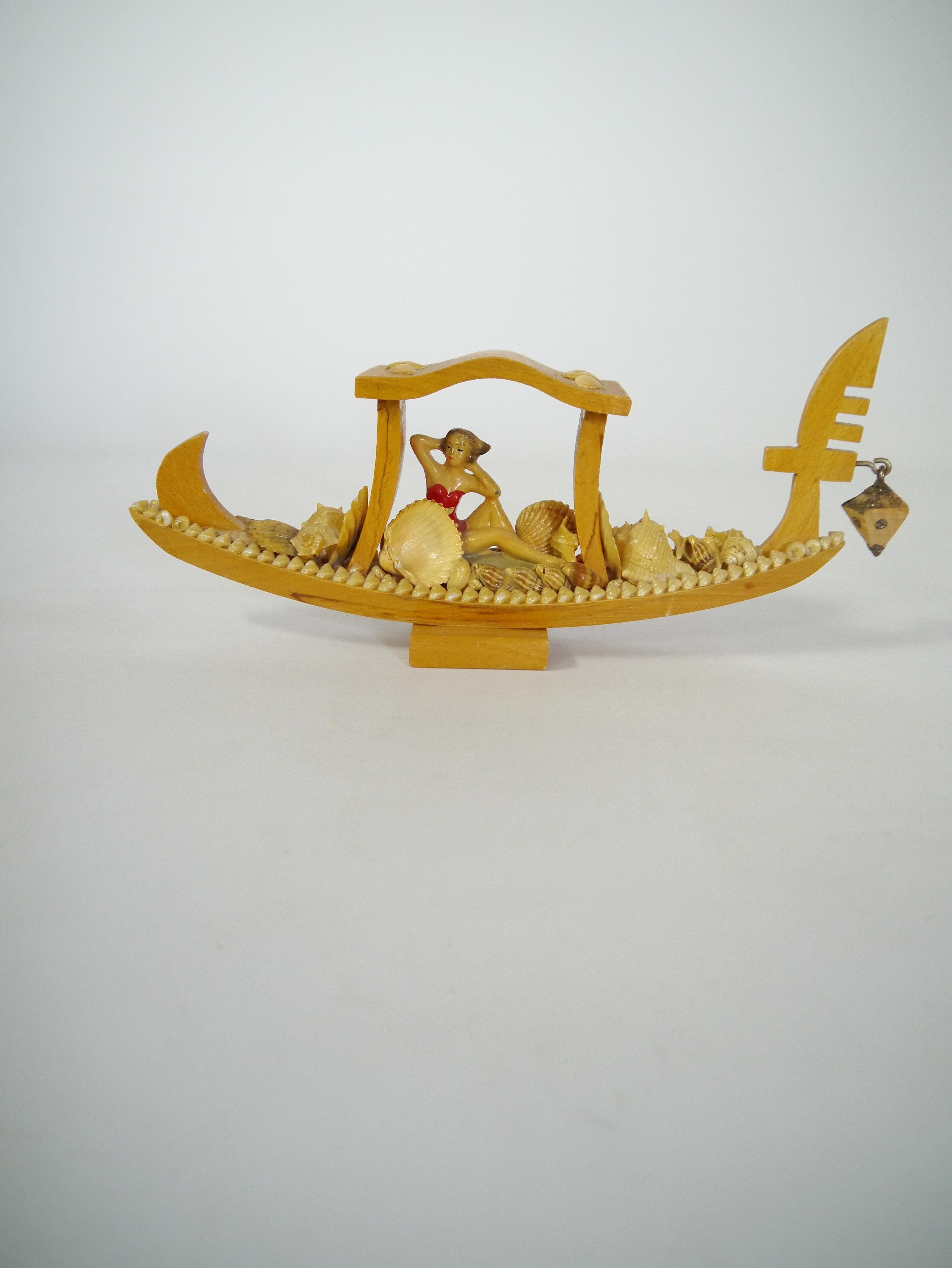 1950s Venice gondola souvenir. Bright wood shellac finish, adorned with seashells and a posing pin-up girl in red swim suit. All very kitsch. Marked 