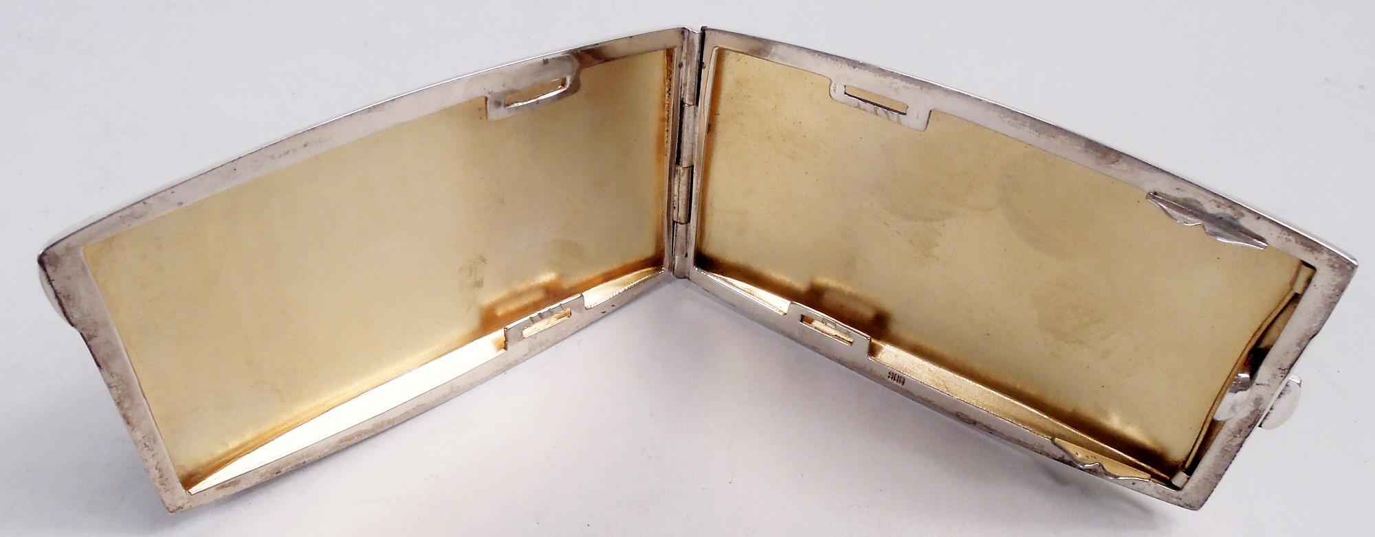 Austrian silver cigarette case with enameled kittens, ca 1910. Rectangular, curved, and hinged. On cover, four preening pinup felines with soft fur and fat paws. Gilt interior. Marked “900”. Gross weight: 3 troy ounces.  