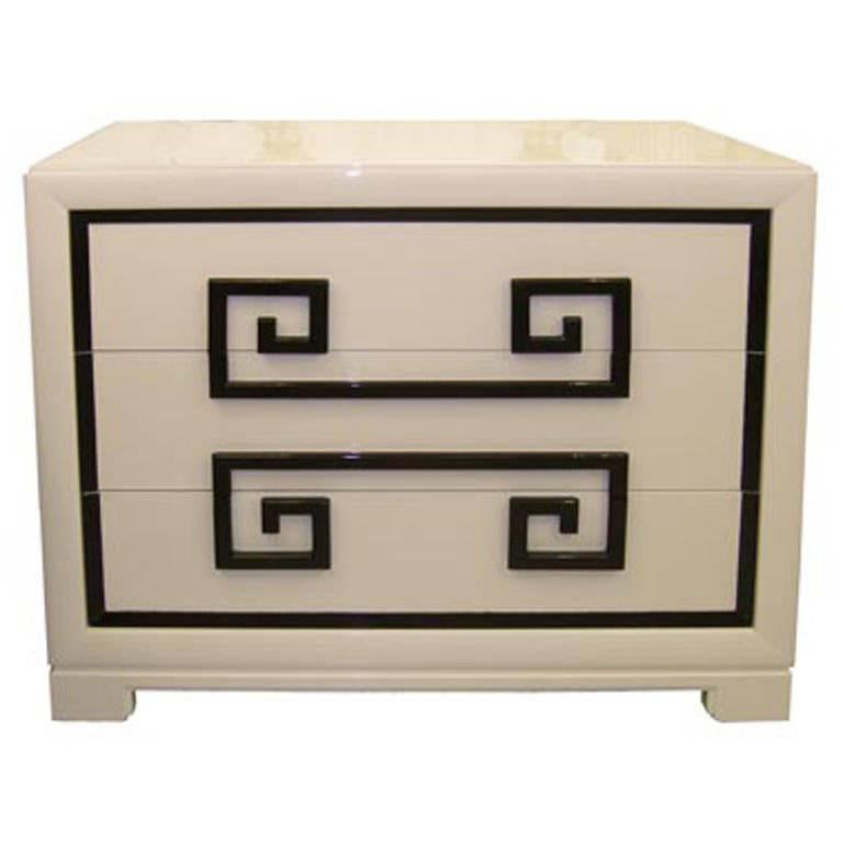 Pair of three-drawer chest of drawers in custom almond lacquer with contrasting dark brown Greek key drawer pulls. Mint restored condition using one of NYC top restoration firms. On view at the New York Design Center, 200 Lexington Ave, 10th floor,