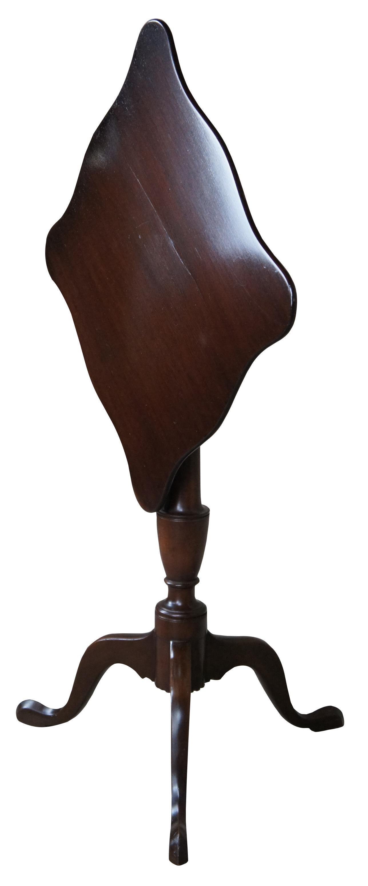 A Federal style mahogany candlestand by Kittinger, circa 1970s. Williamburg Restoration Line. Features a rectangular top with serpentine edge over a baluster turned base with cabriole legs leading to pad feet.
 