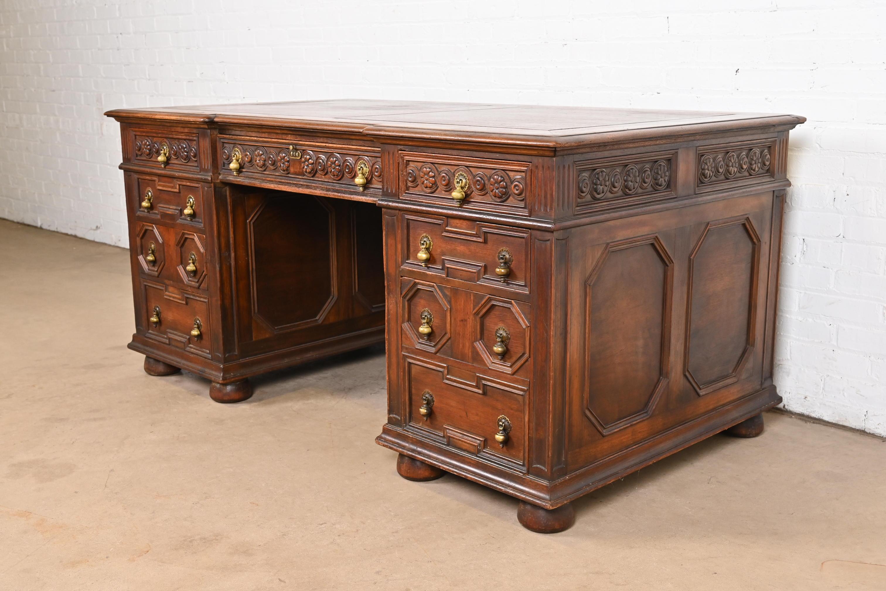 An outstanding English Tudor or William & Mary style executive desk

By Kittinger

USA, Circa 1920s

Gorgeous carved walnut, with original brass hardware.

Measures: 66