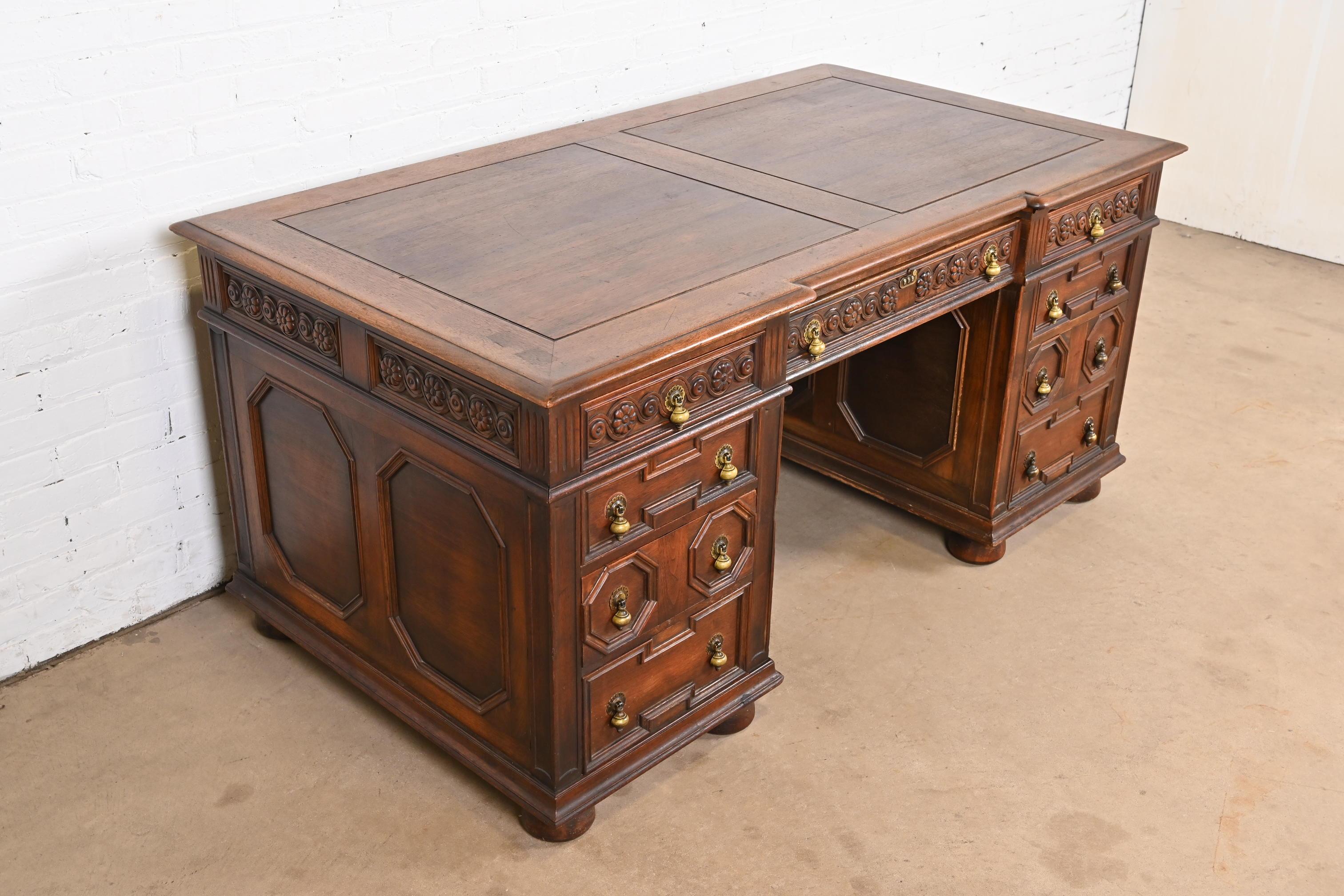 American Kittinger English Tudor Carved Walnut Executive Desk, Circa 1920s