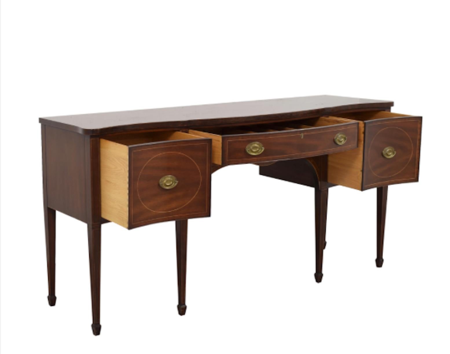 Kittinger extended Sheraton mahogany sideboard with wine drawers, bow-front, with key. 12 1/2