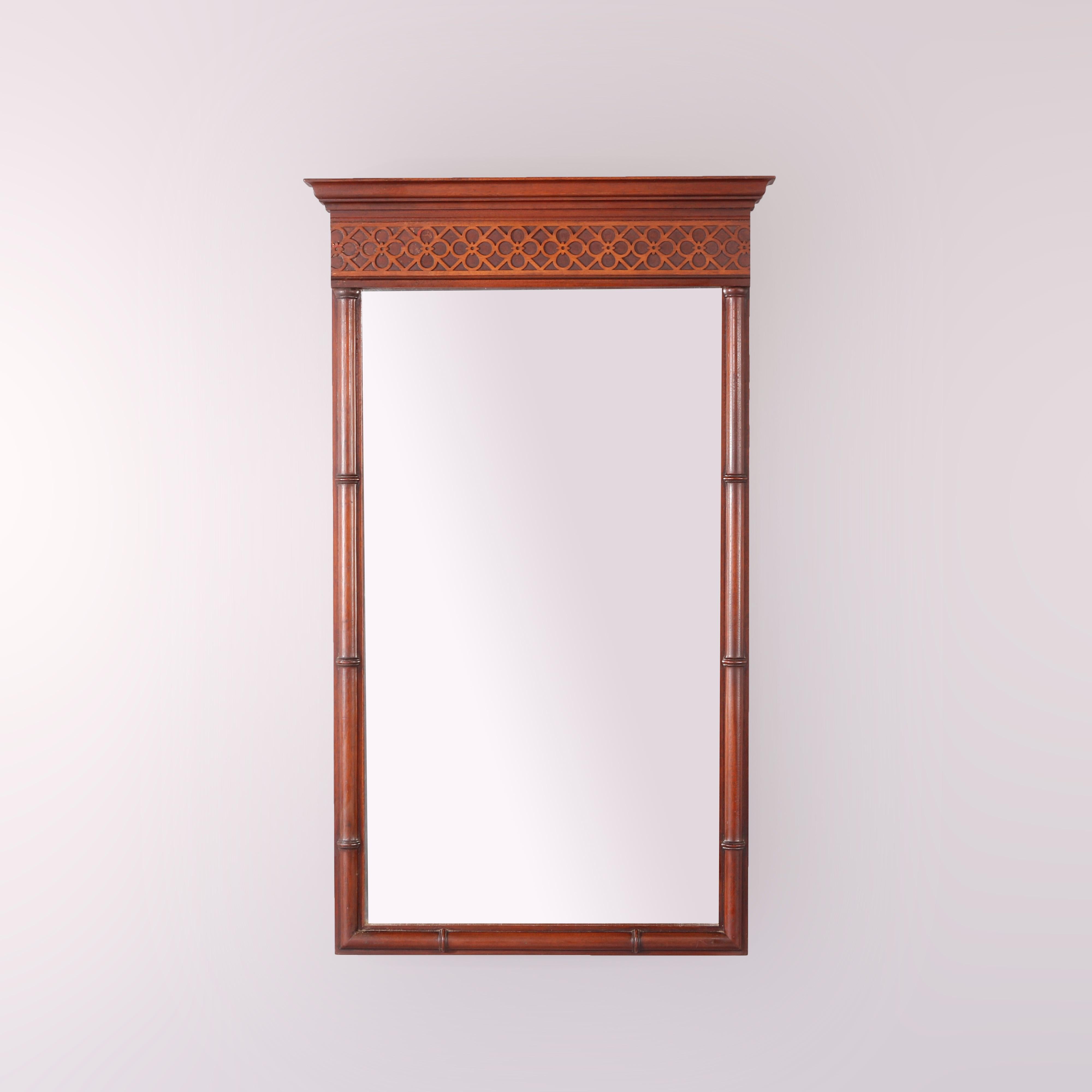 A Federal style wall mirror by Kittinger offers carved frieze with diamond and floral pattern over carved bamboo form frame, en verso maker label as photographed, c1930

Measures - 33''H x 19.75''W x 2.75''D.