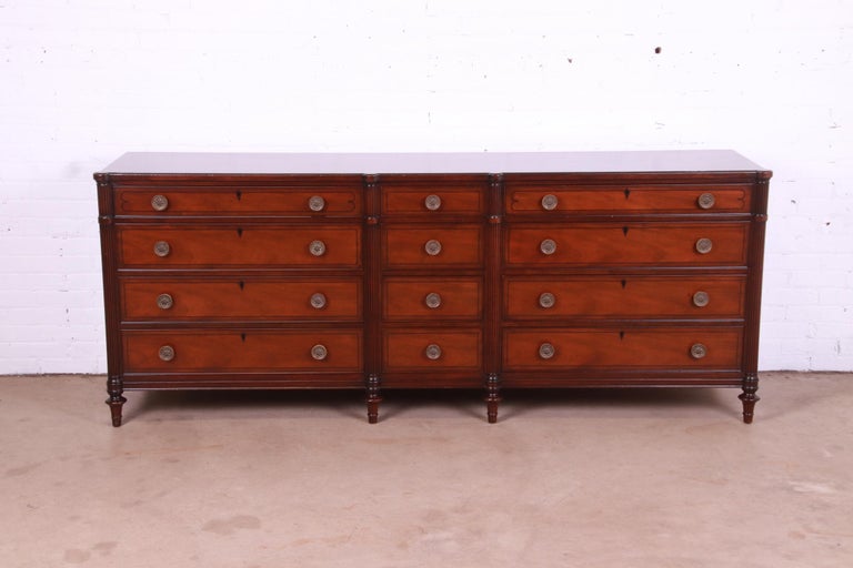 An exceptional French Regency Louis XVI style twelve-drawer bureau dresser or credenza

By Kittinger

USA, Mid-20th Century

Carved mahogany, with original brass hardware.

Measures: 89