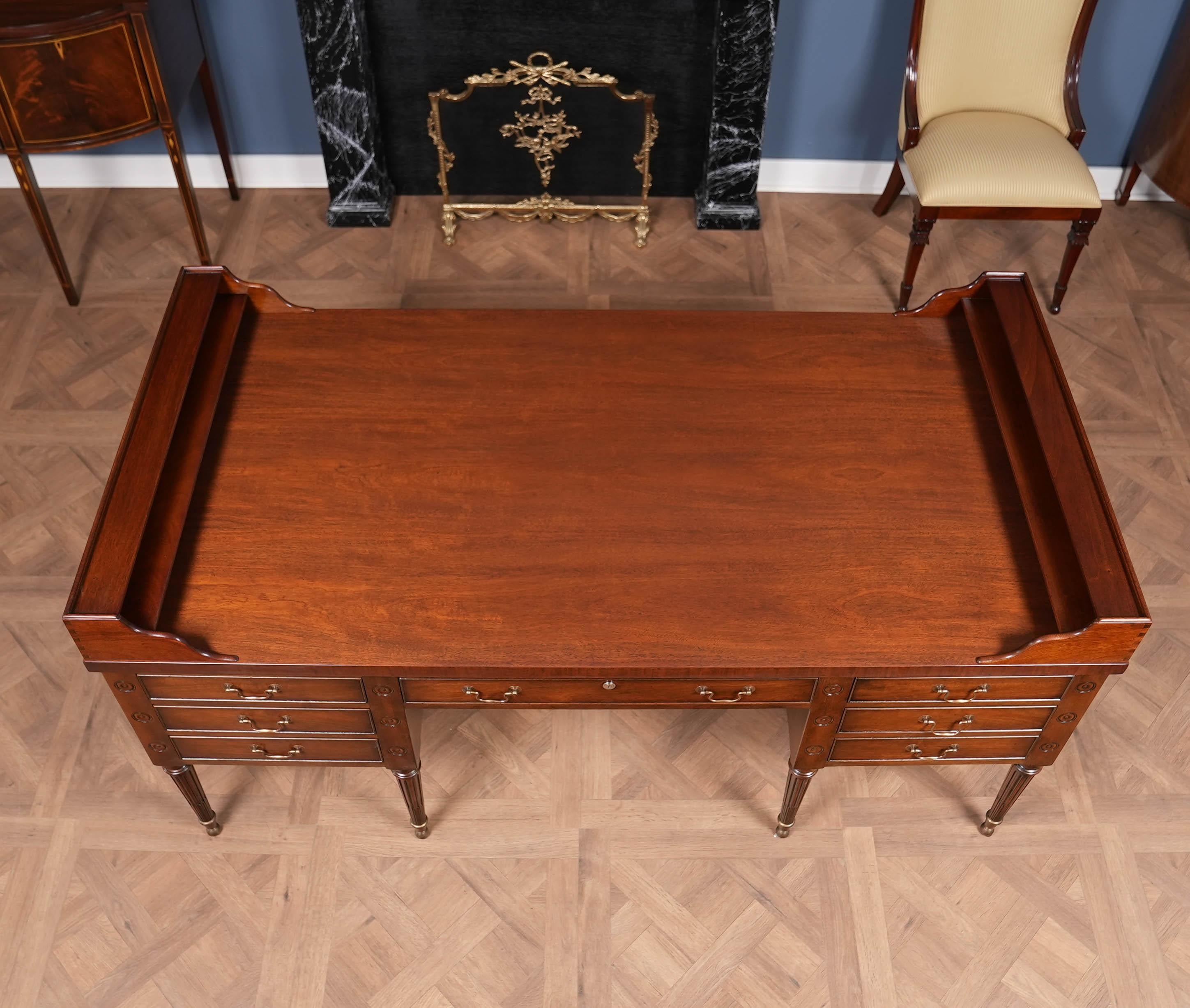 The absolute highest quality piece of American cabinet making is exemplified in this VINTAGE Kittinger George Washington Style Desk. From the recently refinished top to the brass capped legs on the bottom all of the components work together to