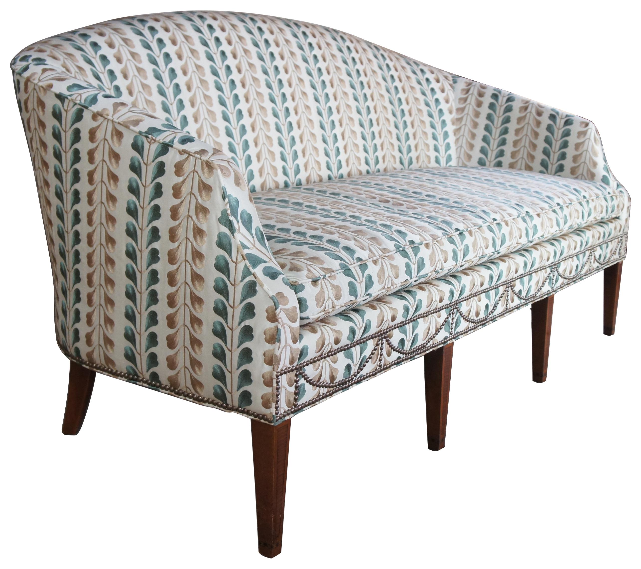 Kittinger hepplewhite bowback mahogany inlaid sofa Osborn & Little Federal

Early Kittinger Bowback sofa in hepplewhite style. Upholstered in Osborn & Little earthy green and gold fabric with nailhead trim. Made from mahogany with tapered and