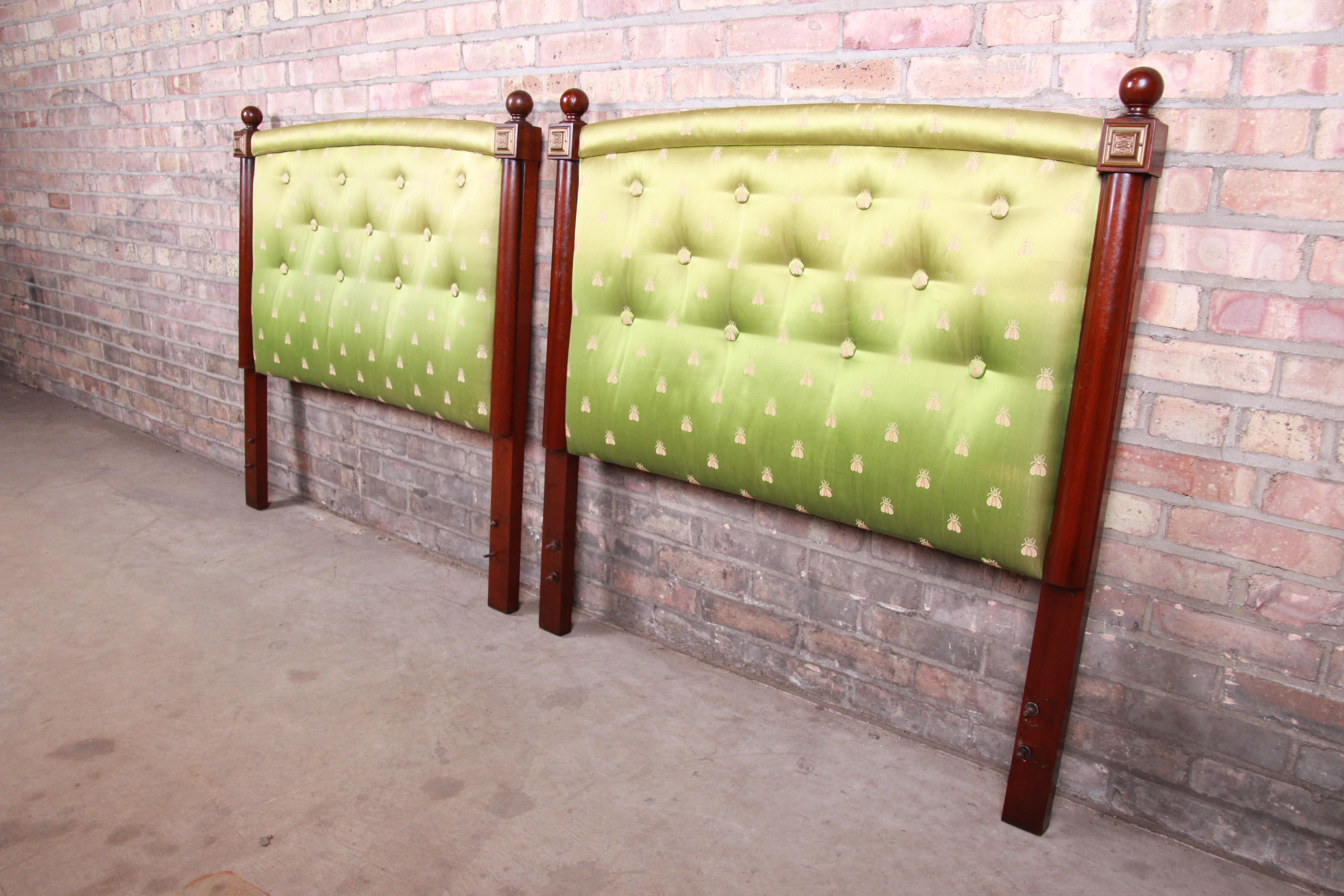 A gorgeous pair of twin size headboards

By Kittinger Furniture Co.

USA, circa 1960s

Carved mahogany, with brass accents and unique tufted green beetle motif upholstery.

Measures: 39.25