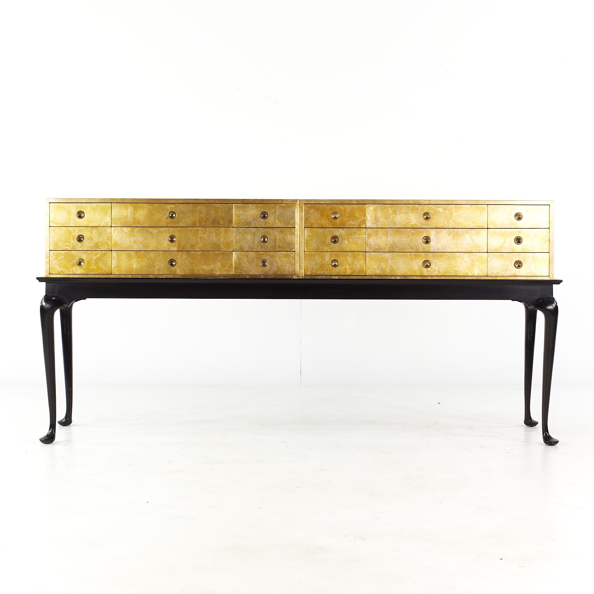 Kittinger mid century gold leaf chest of drawers on black lacquer stand

This chest of drawers measures: 71.25 wide x 21.5 deep x 36.5 inches high

All pieces of furniture can be had in what we call restored vintage condition. That means the