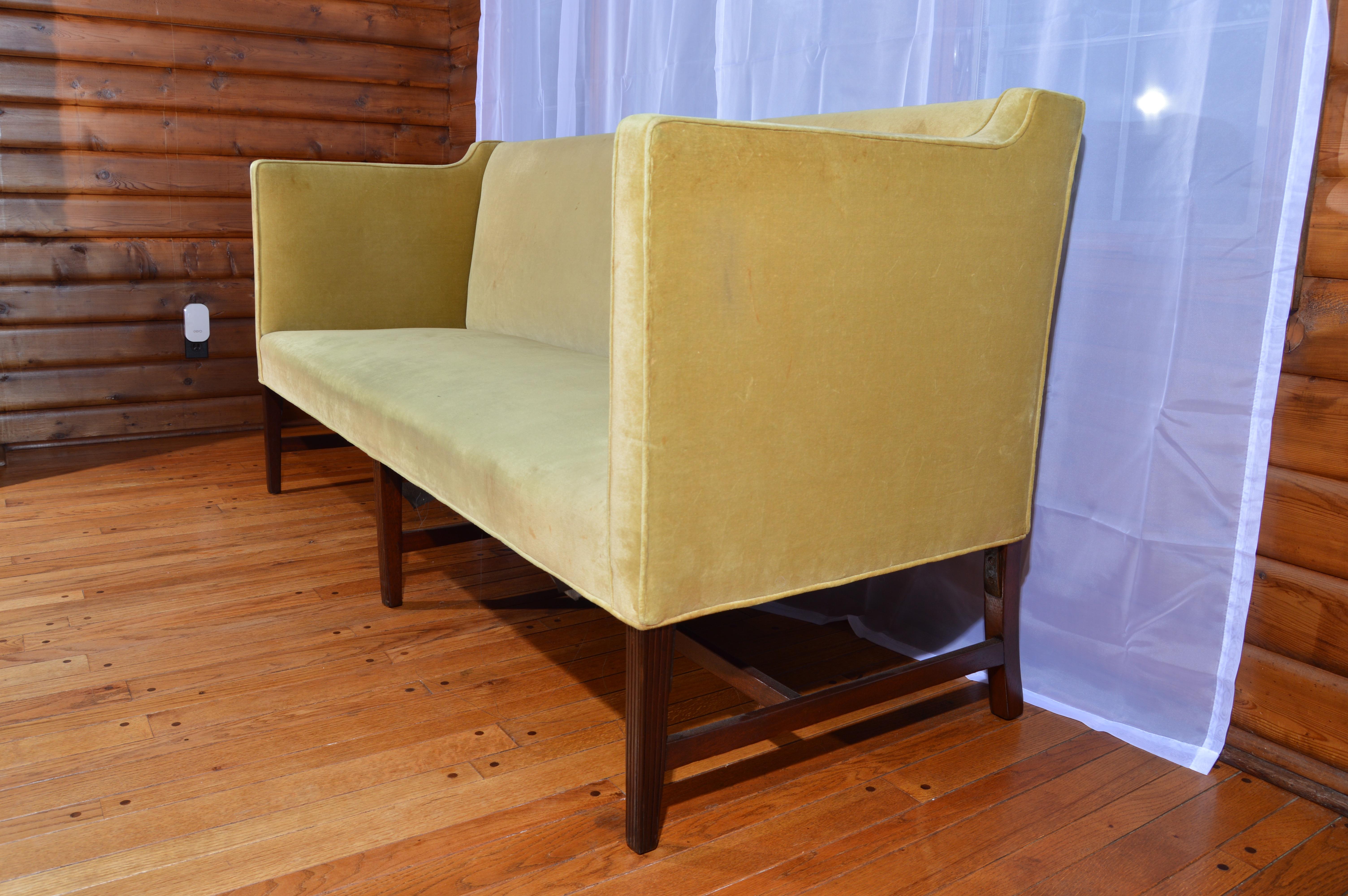 A beautiful early 20th century Chippendale box sofa having mohair upholstery on mahogany frame. Solid throughout. Normal ware to upholstery. 
Measures: 36 x 75 x 27