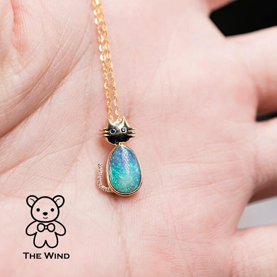 Stylish Kitty Cat Pendant Necklace with Australian Boulder Opal, Diamond, Sapphire Eyes 18K Yellow Gold.


Free Domestic USPS First Class Shipping! Free Gift Bag or Box with every order!

Opal—the queen of gemstones, is one of the most beautiful