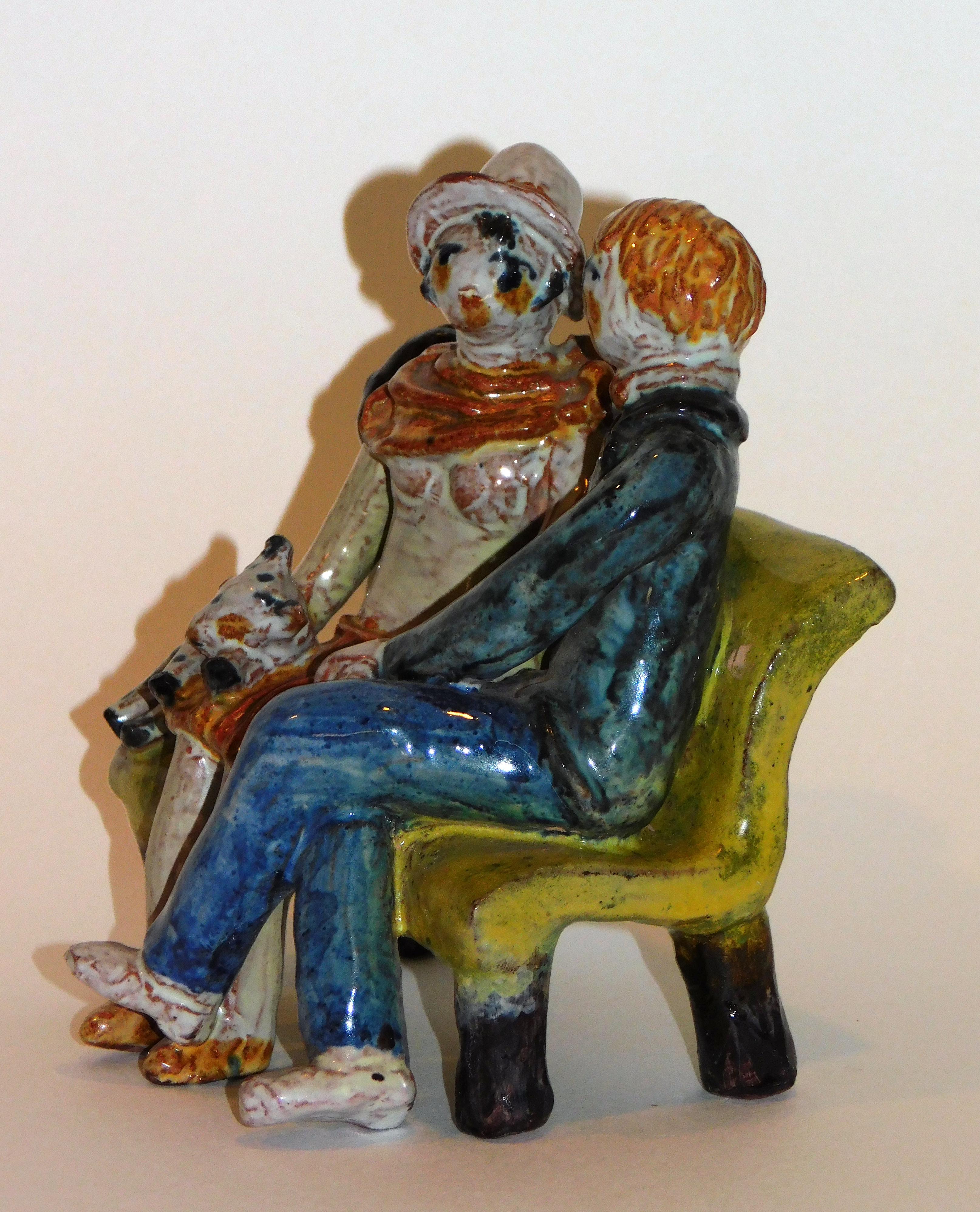 Excellent ceramic designed by well known Wiener Werkstatte artist Kitty Rix. It depicts a young couple on a park bench holding hands.
Executed by the Wiener Werkstatte. The figurine measures 5 1/2