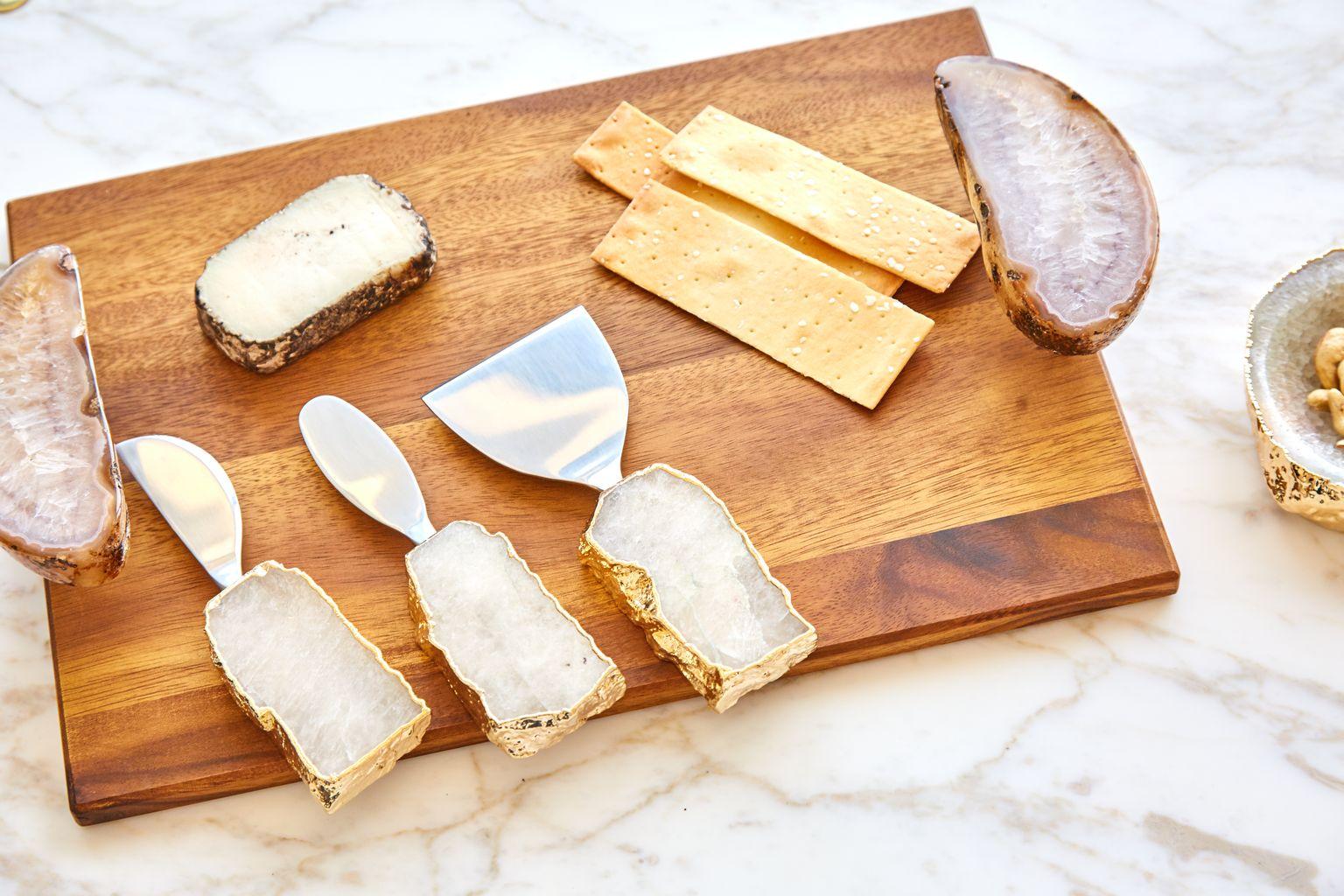 This unique set of three cheese knives and spreaders features polished, semi-precious gemstones, and electroplated 24k gold. This set is the perfect wedding or hostess gift. Functional, yet completely unusual--an instant heirloom. This set is