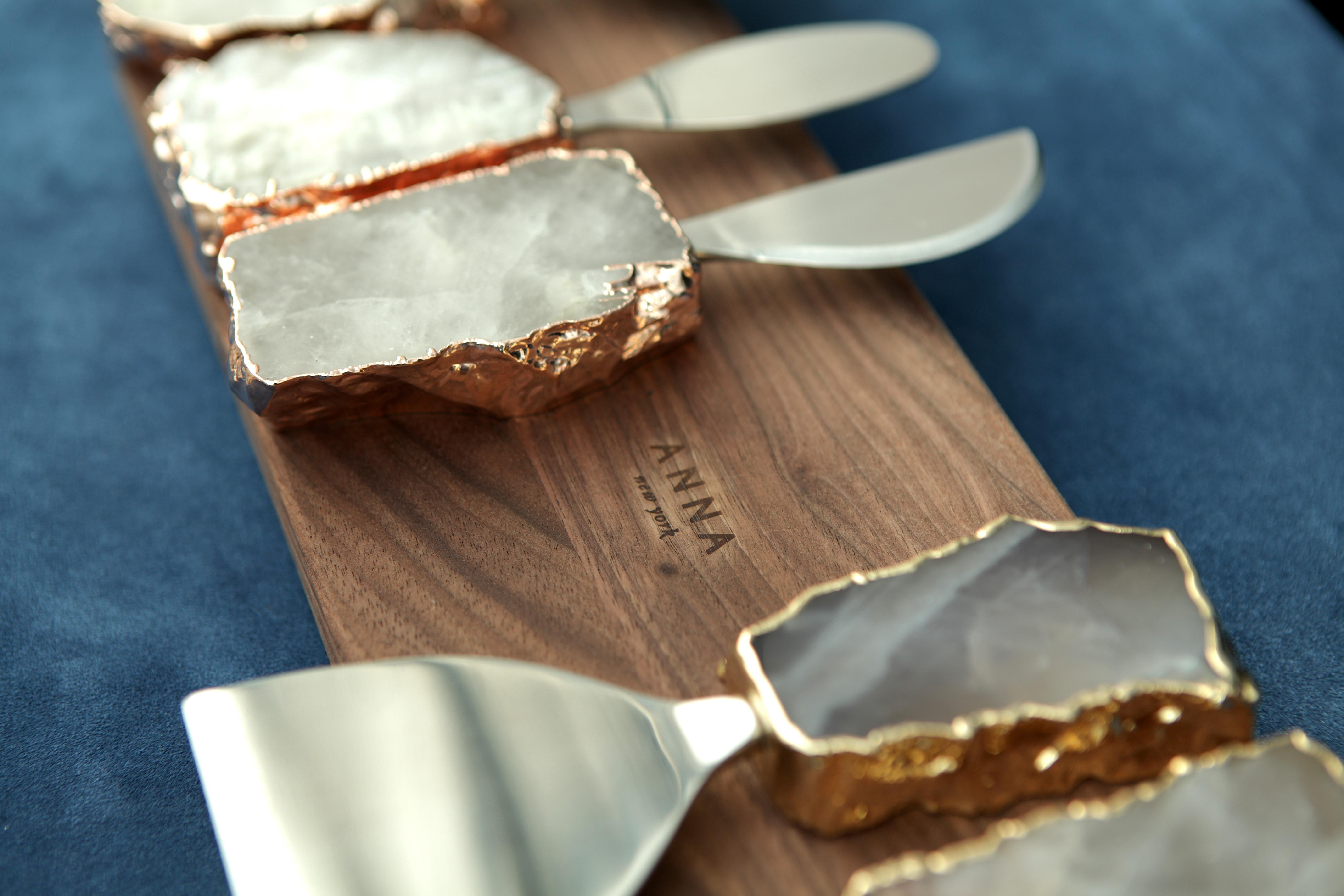 The Kiva Cheese Set is a trio of knives and spreaders designed to easily cut hard cheeses, to smoothly spread soft cheeses, and to delight all guests. The handles are crafted from beautiful semi-precious gemstones like Crystal, which is thought to