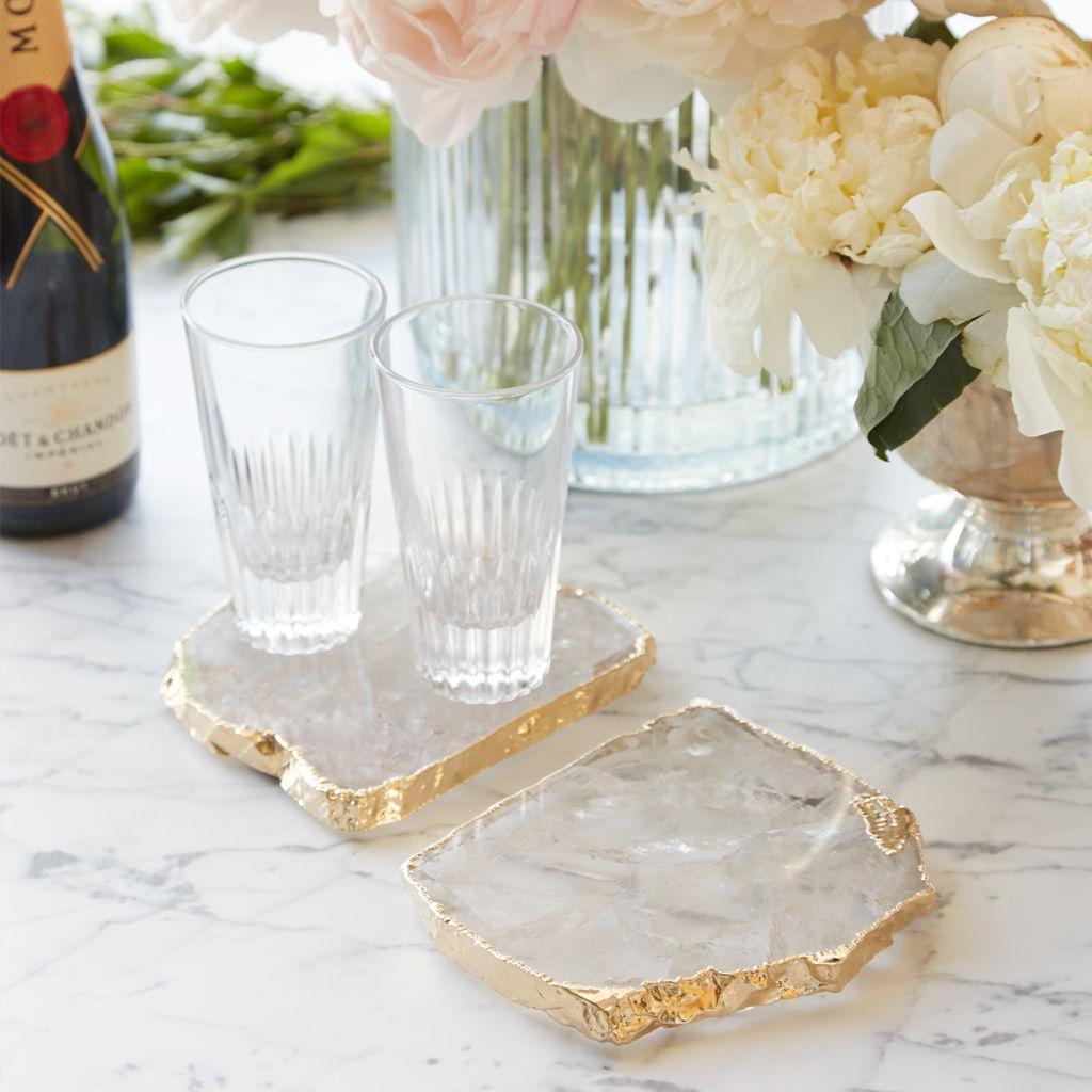 The Kivita Coasters are organic luxe for your favorite drink or bottle of wine. Oversized and dramatic, these jewels for your table are made from crystal quartz, thought to bring calmness & peace to your home, and 24k gold. Formed by liquid hot