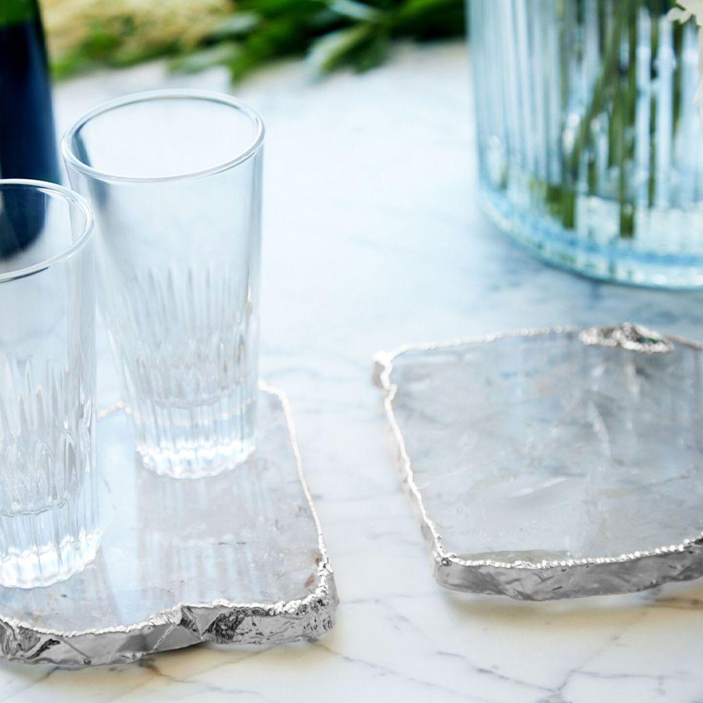 The Kivita Coasters are organic luxe for your favorite drink or bottle of wine. Oversized and dramatic, these jewels for your table are made from semi-precious gemstones, thought to bring calmness & peace to your home, and Pure Silver. Formed by