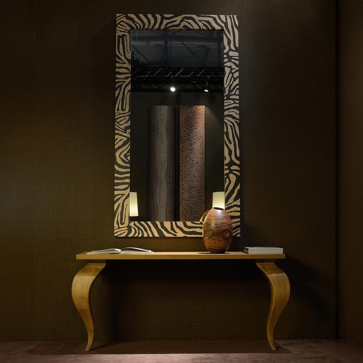An audacious and iconic accent for an eclectic or minimalist interior alike, this magnificent bronzed mirror is distinguished by a solid wood frame with zebra-striped inlay work. Please contact the Concierge service for further information on this