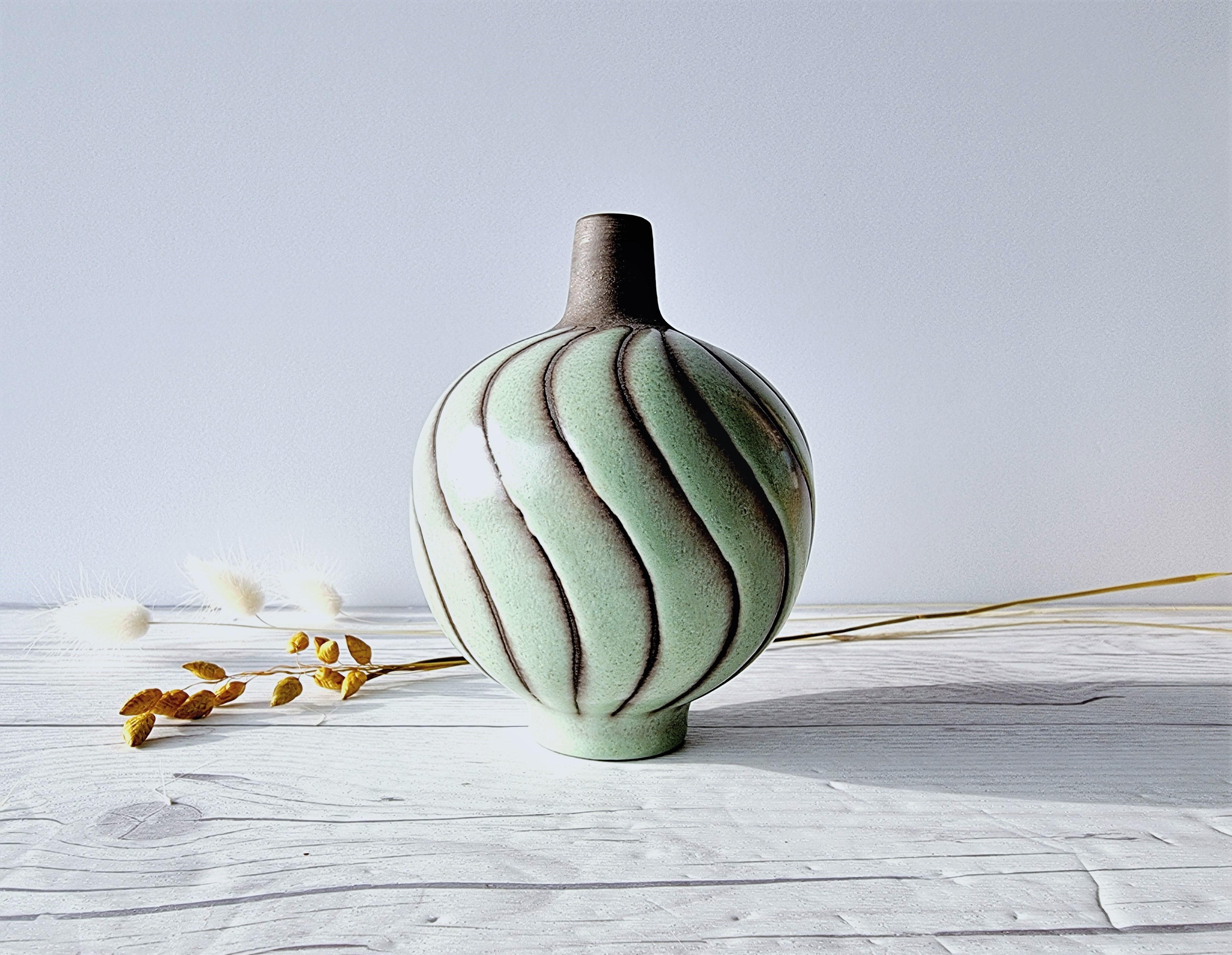 This exceptional work of Swedish Modernist is by Kjell Blomberg (b. 1931 - d. 1989) for Upsala Ekeby. Blomberg was a leading Swedish Swedish ceramicist, designer and artist, known for many series he designed at Upsala Ekeby and Gullaskruf