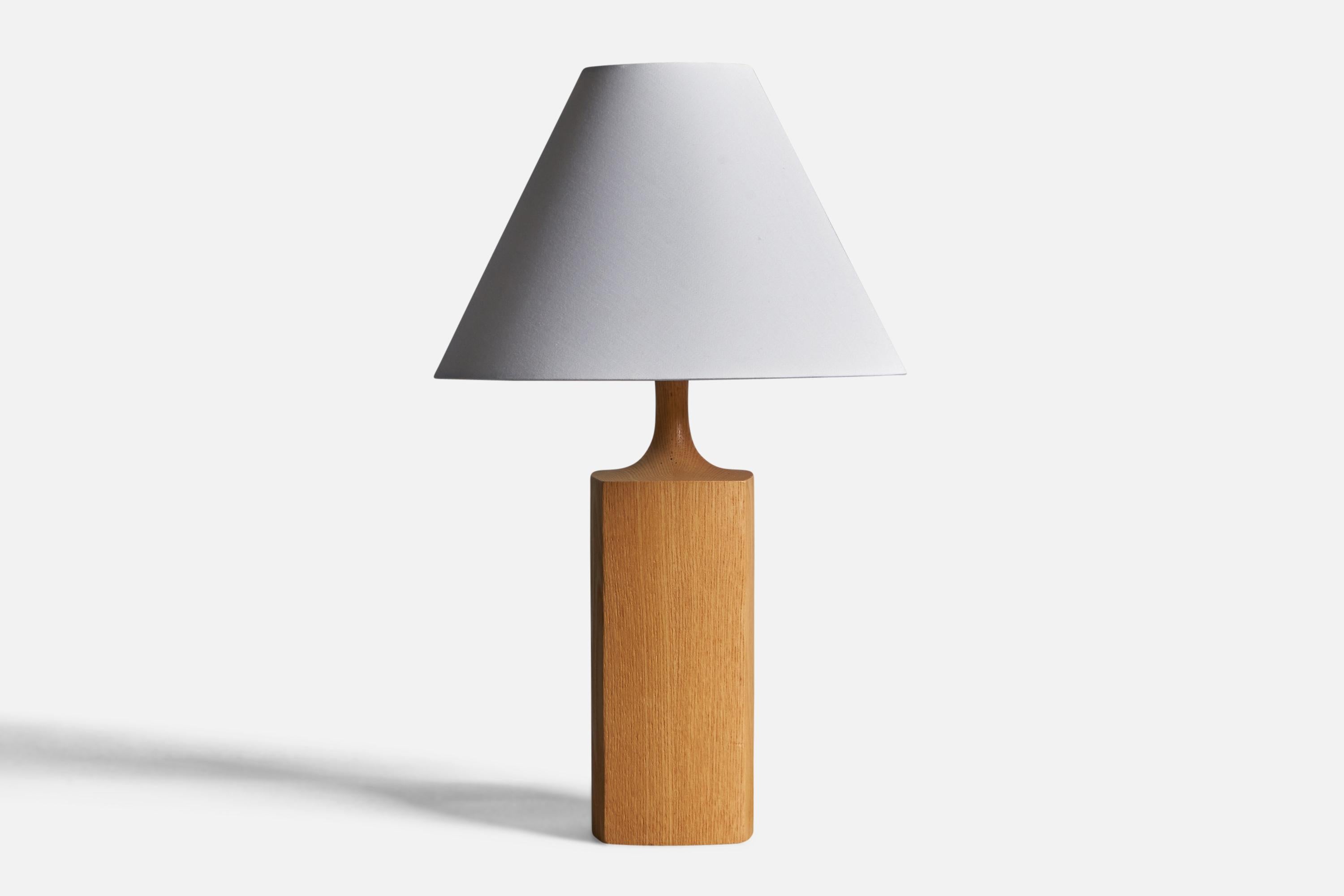 An oak table lamp designed and produced by Kjell Blomberg, Sweden, 1970s.

Dimensions of Lamp (inches): 13.3