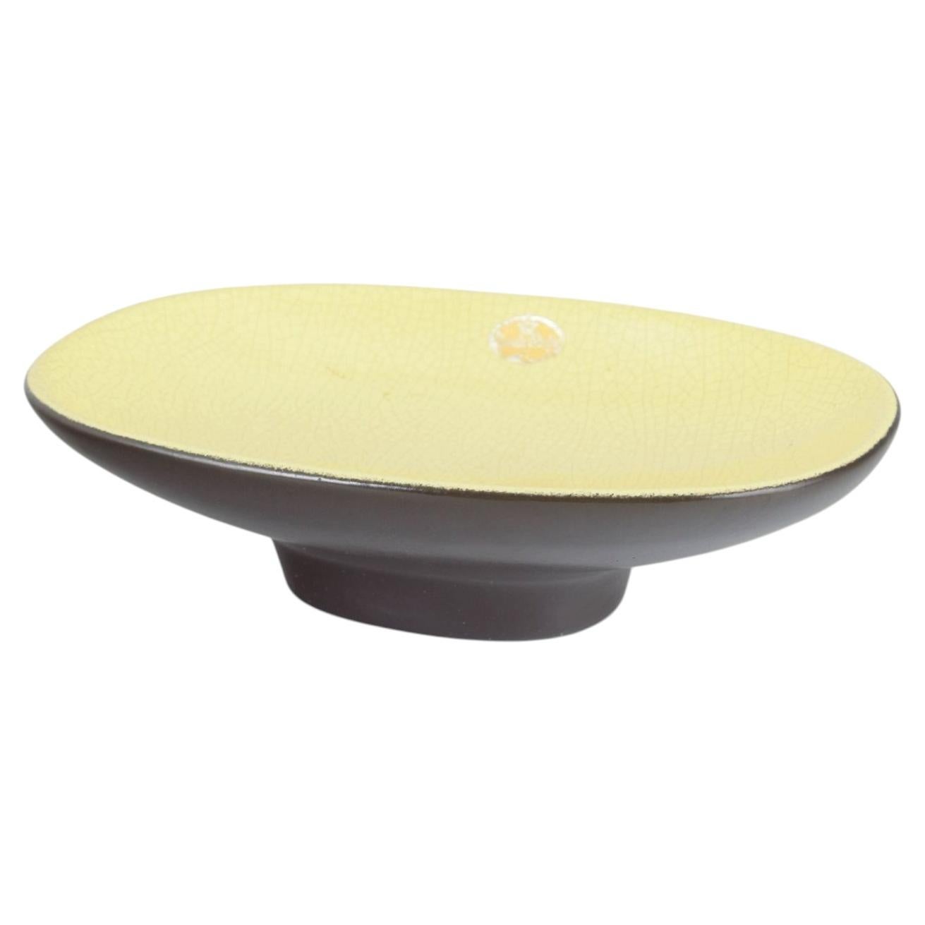 Kjell Blomberg, Upsala Ekeby. Oval dish on raised foot. Yellow and brown glaze. For Sale