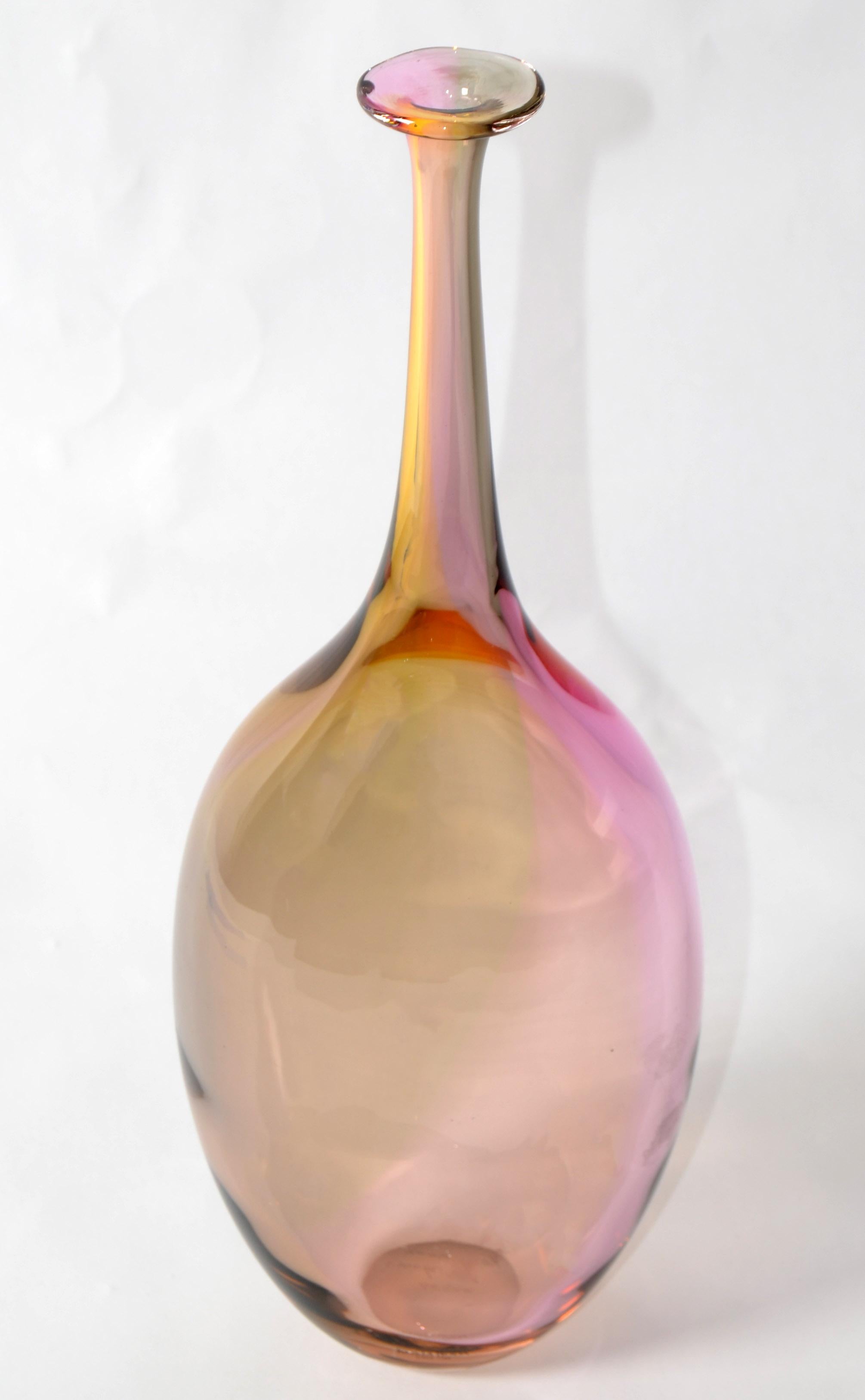 Fidji Collection Mid-Century Modern long neck bottle, art glass weed vase designed by Kjell Engman for Kosta Boda made in Sweden.
Lead-free crystal in the colors inspired by a rainbow reflection of oil spilled on water.
Engraved at the bottom and