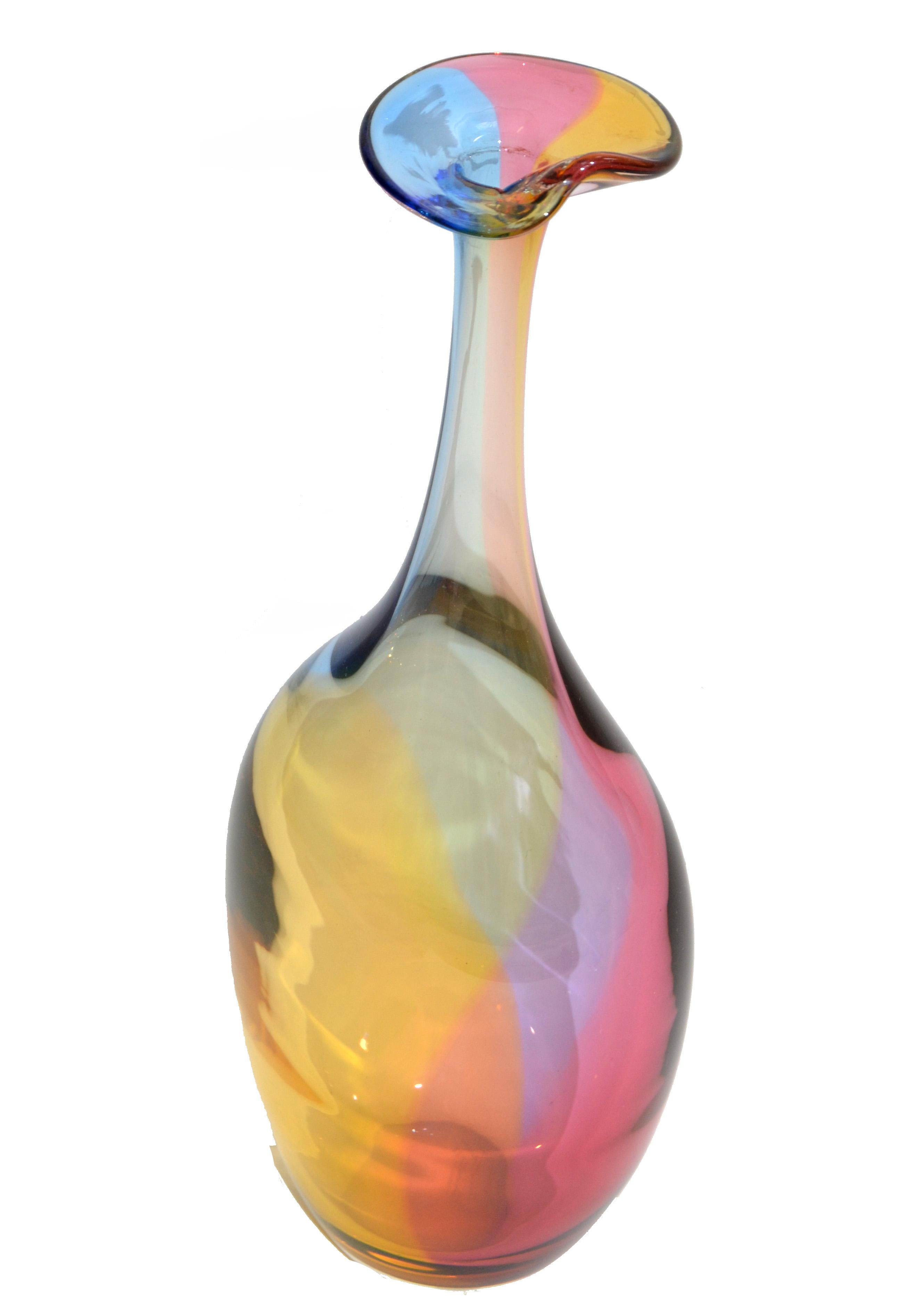 Fidji Collection Mid-Century Modern long neck bottle, art glass weed vase designed by Kjell Engman for Kosta Boda made in Sweden.
Lead-free crystal in the colors inspired by a rainbow reflection of oil spilled on water.
Engraved at the bottom and