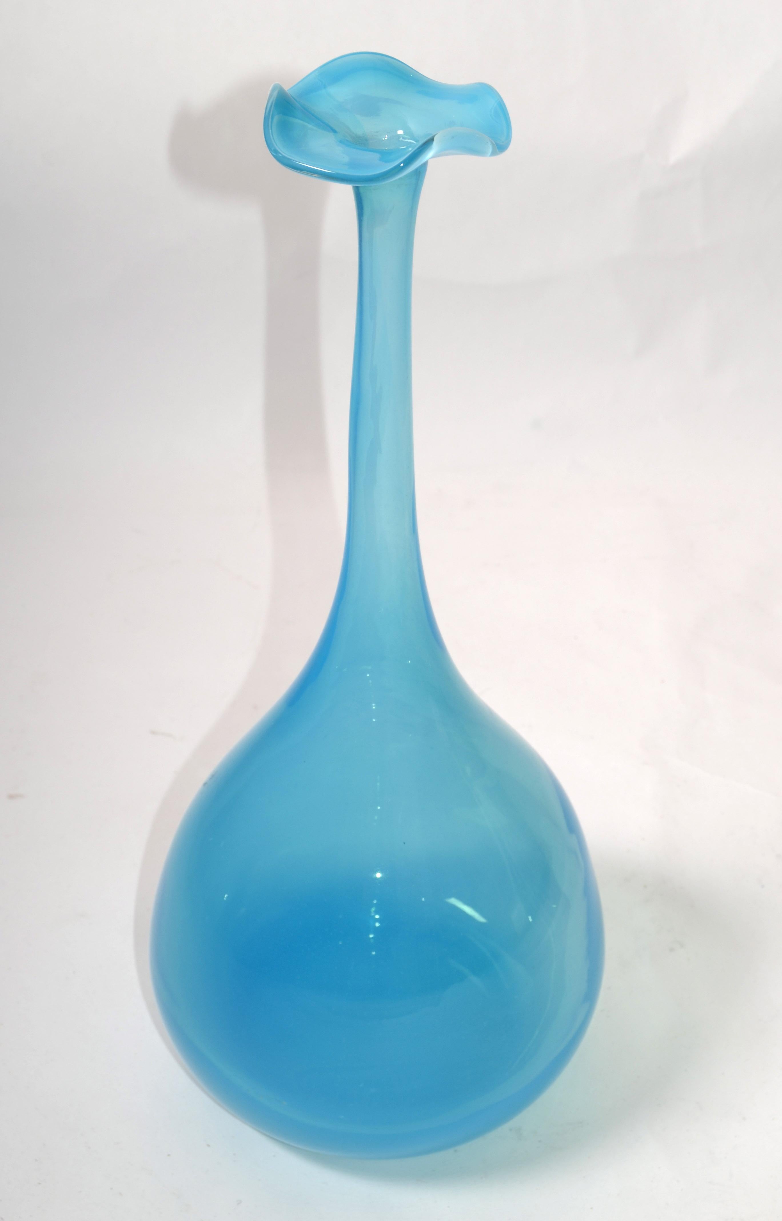 Mid-Century Modern blue long neck bottle, art glass weed vase in the Style of Kjell Engman attributed to Kosta Boda made in Sweden.
Lead-free crystal in sky blue color. Great Gift idea or as a single Vase on any Table Setting.
The Opening