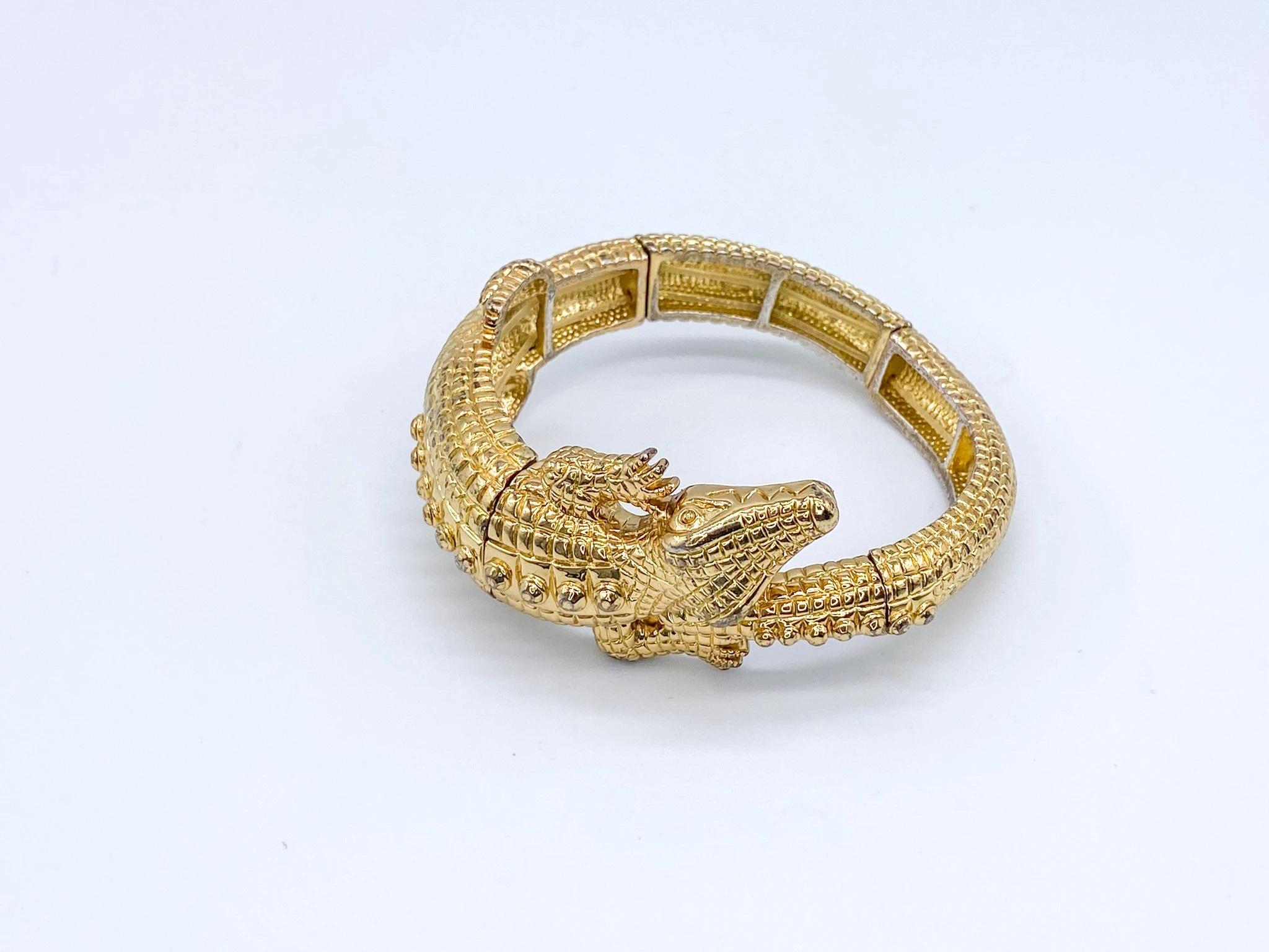 Kenneth Jay Lane 1970s Vintage Aligator bracelet 

-Excellent condition overall. Small amount of storage patina to metal - photos accurately display this.
-Fully authenticated by experts
-Features the KJL 1970s stamp inside