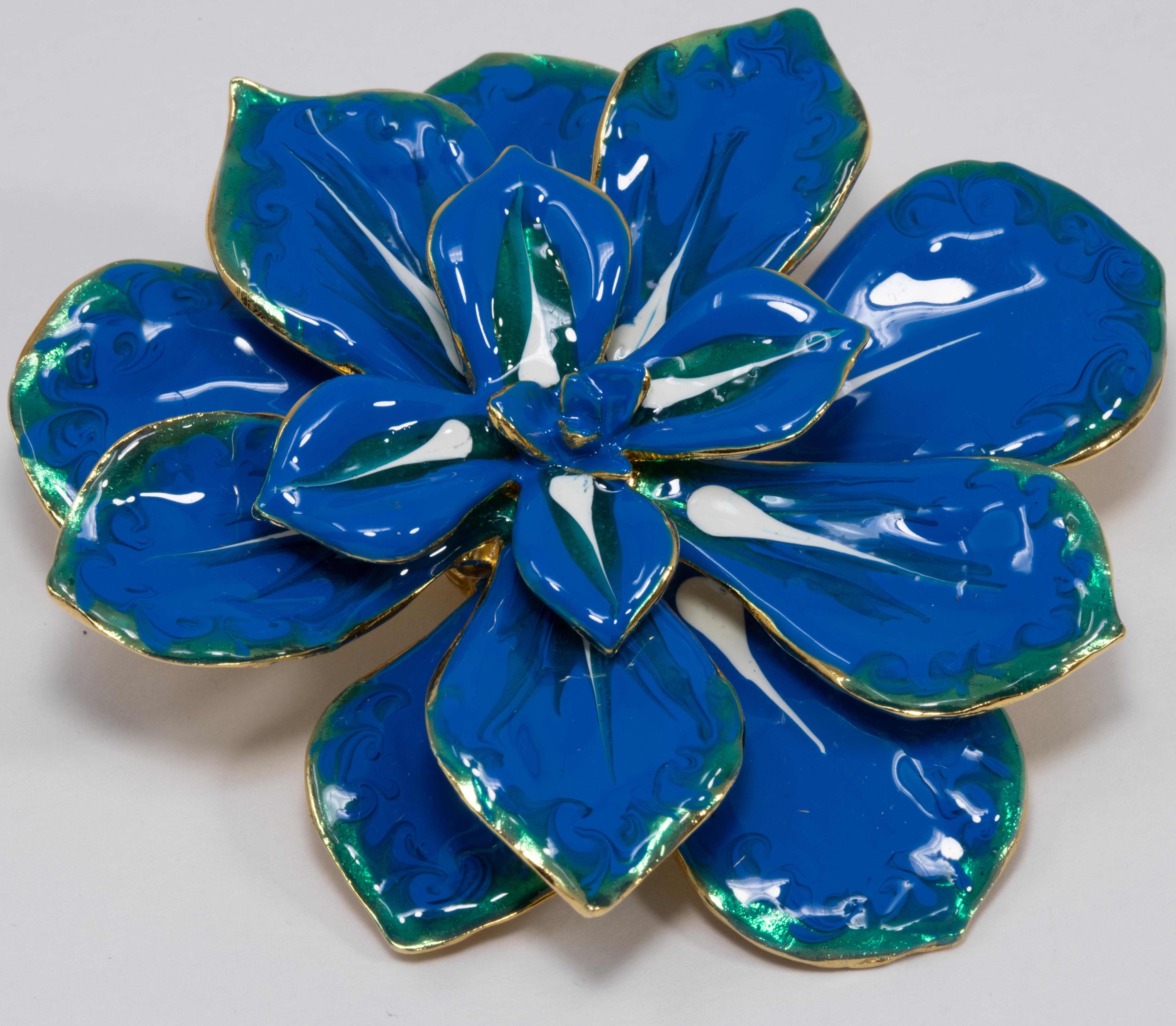 A blooming flower pin brooch by Kenneth Jay Lane! Vibrant blue, teal, and white painted enamel petals on a goldtone metal setting.

Hallmarks: Kenneth © Lane