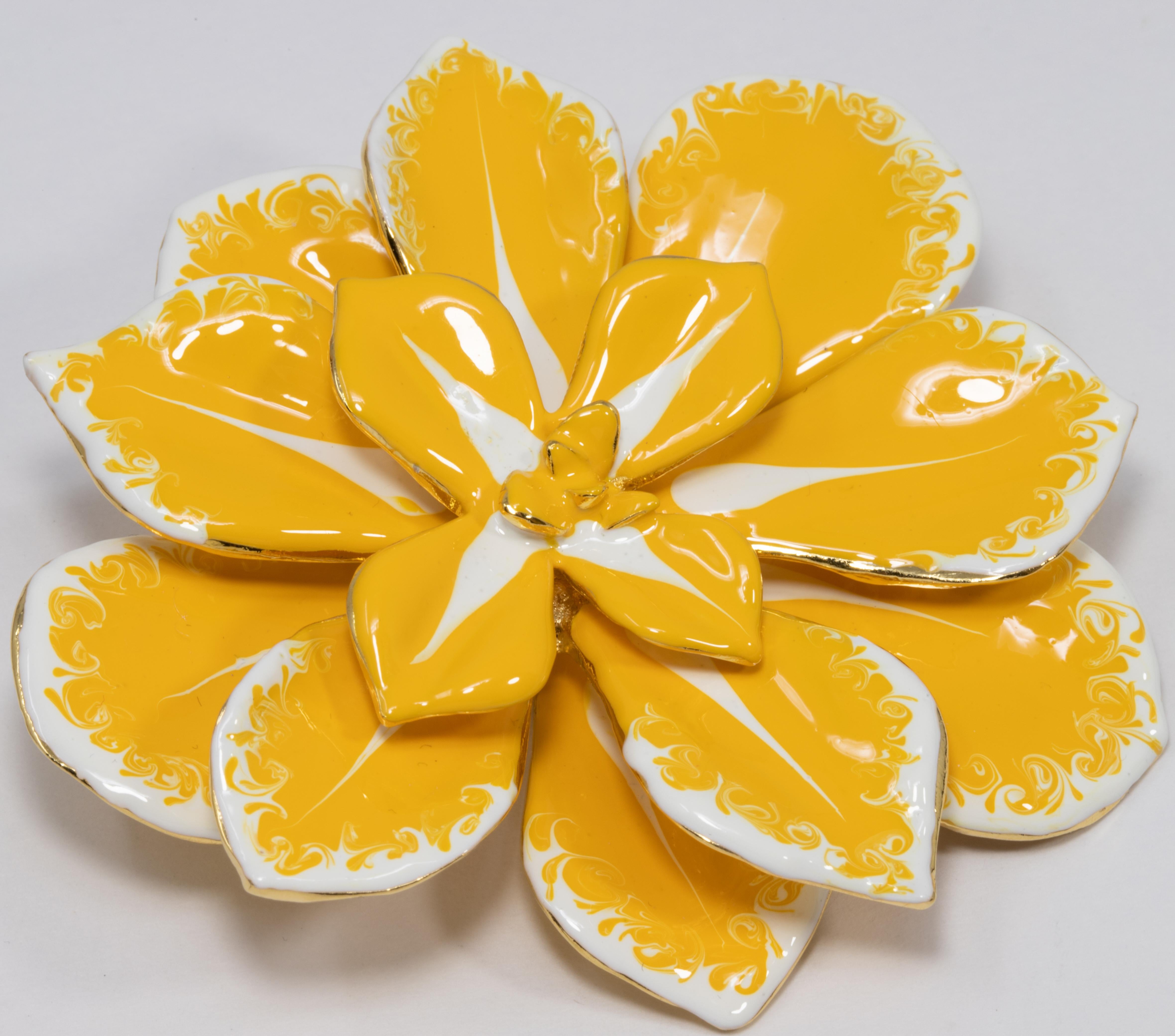 A blooming flower pin brooch by Kenneth Jay Lane! Vibrant yellow and white painted enamel petals on a goldtone metal setting.

Hallmarks: Kenneth © Lane