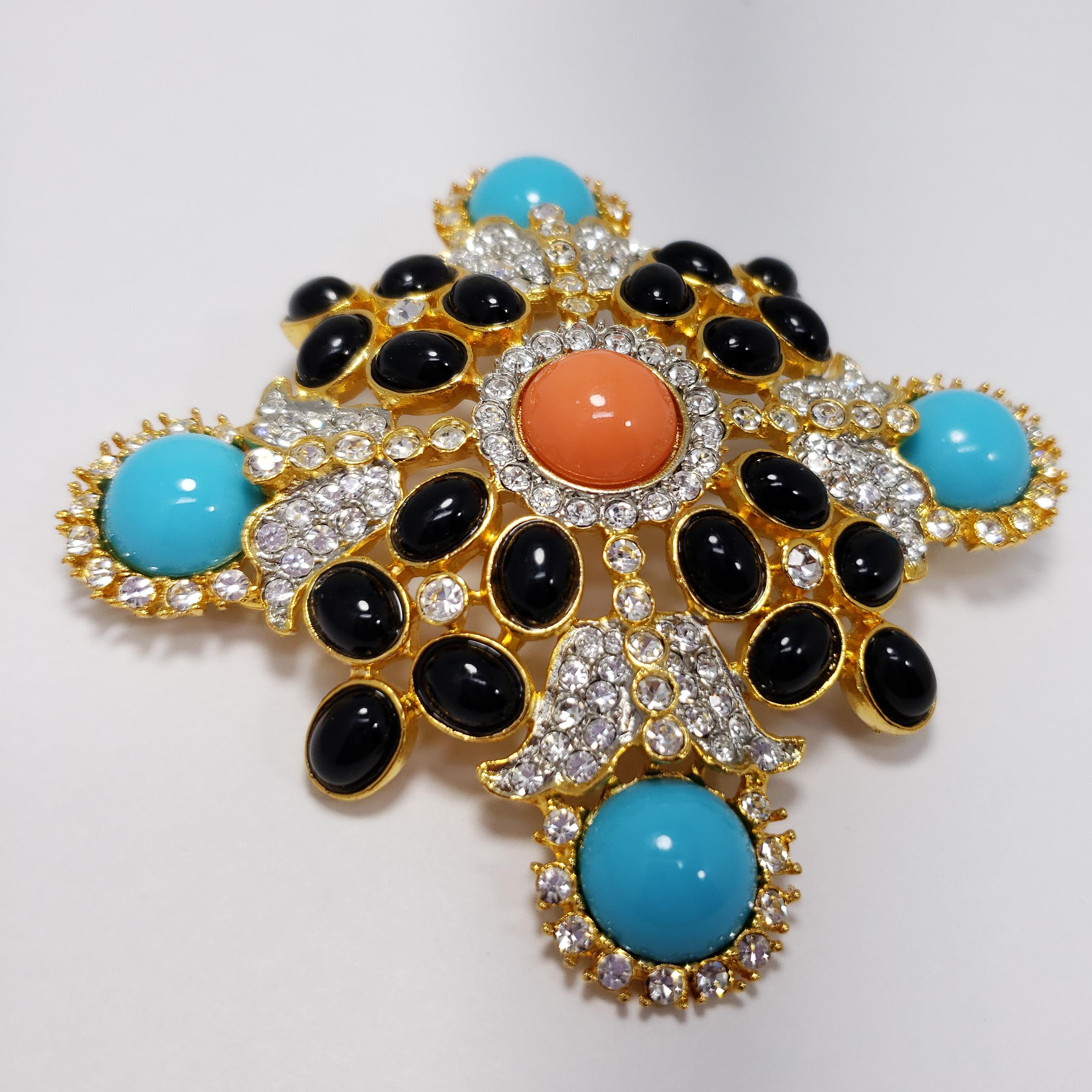 Pavé crystals and black, coral, & turquoise cabochons decorate this regal looking golden pin brooch. This beautiful piece can also be worn as a pendant.

Hallmarks: Kenneth Lane, Made in USA