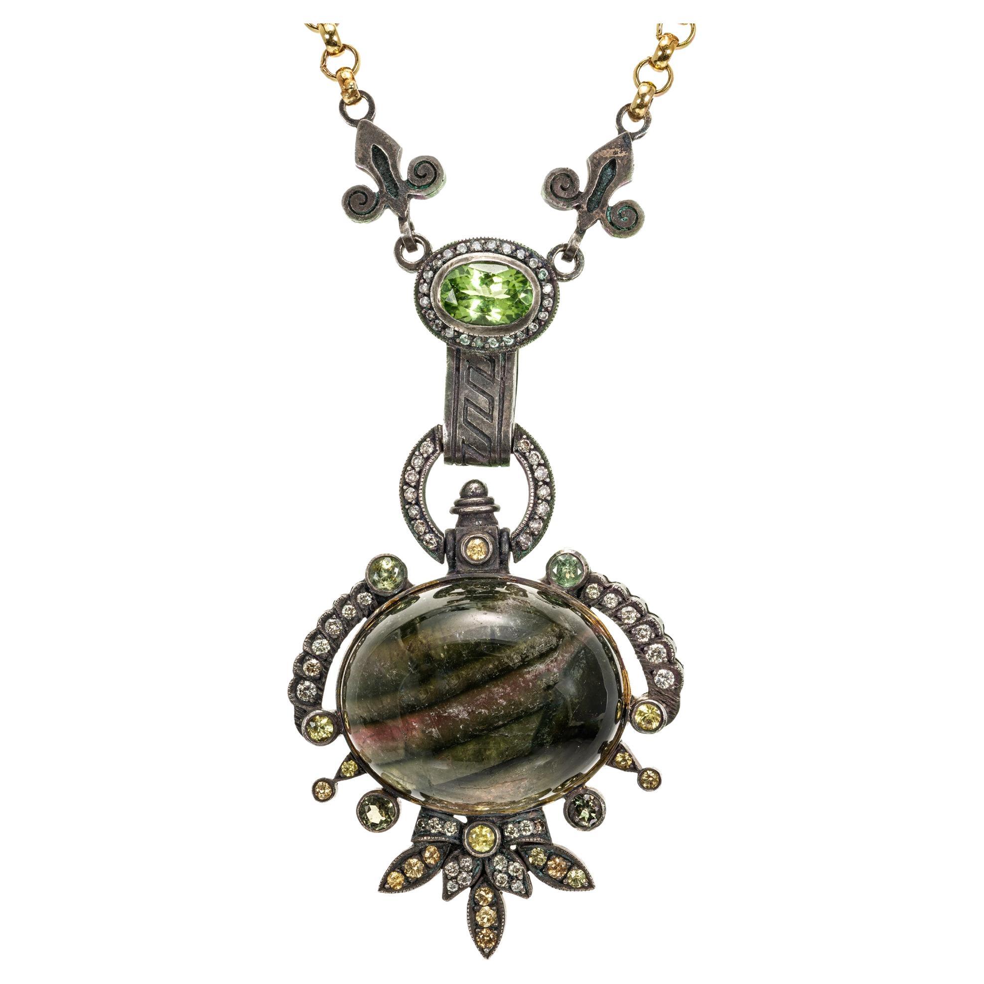 KK Wearable Sculpture Etruscan style necklace in 18k yellow gold and blackened Sterling silver. The center is a unique natural banded multi-color Tourmaline surrounded by 68 round diamonds and 21 assorted green, pink and golden brown tourmalines. 17