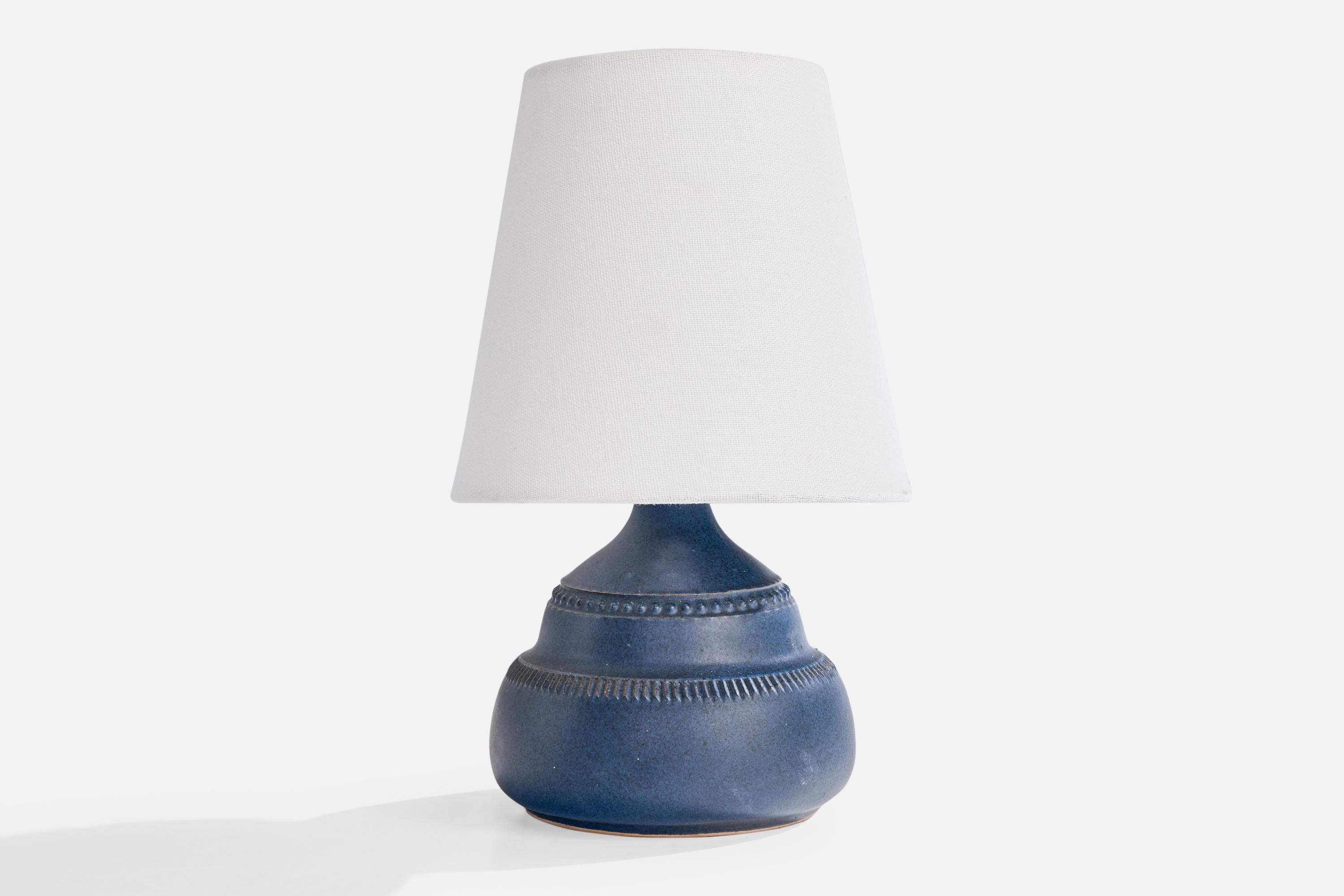 A blue-glazed ceramic table lamp produced by Klase Höganäs, Sweden, c. 1960s.

Wear consistent with age and use

Overall Dimensions (inches): 9.5