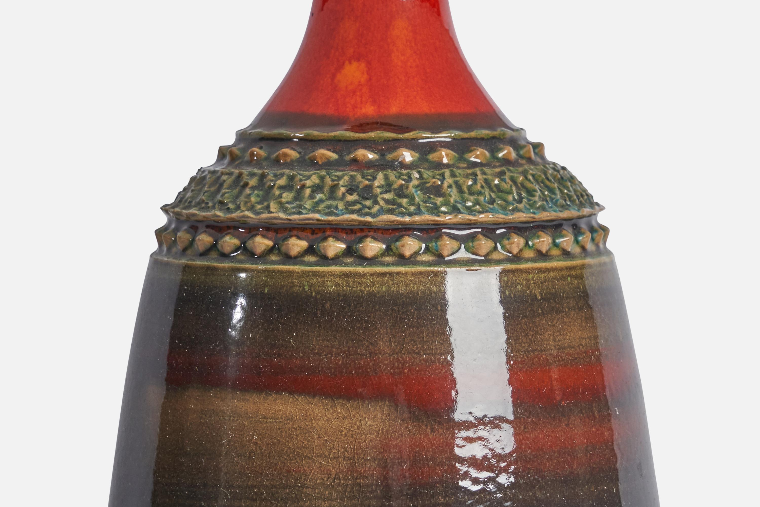 A red and green-glazed stoneware table lamp designed and produced by Klase Höganäs, Sweden, c. 1960s.

Dimensions of Lamp (inches): 15.75” H x 5.5” Diameter
Dimensions of Shade (inches): 4.5” Top Diameter x 16” Bottom Diameter x 7.25” H
Dimensions