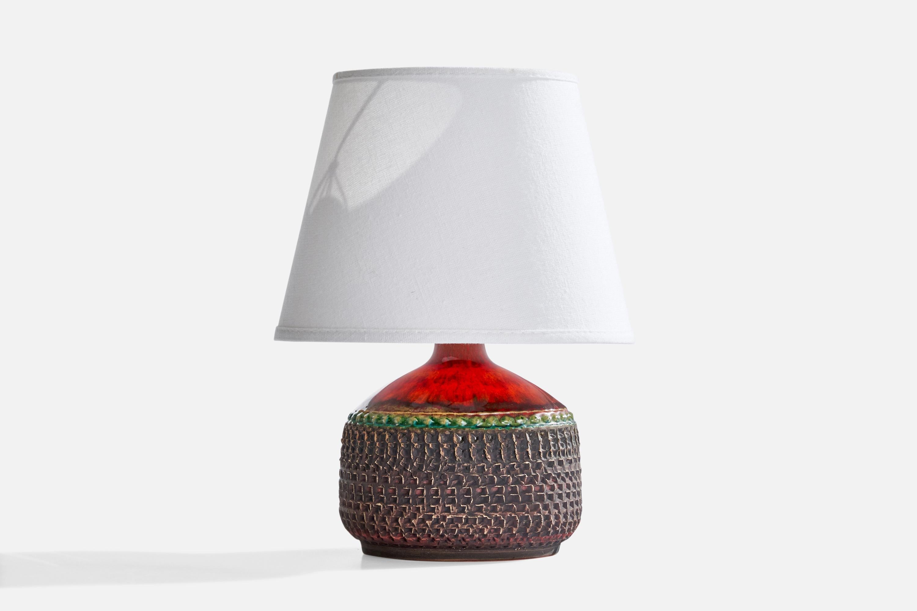 A red and green-glazed stoneware table lamp produced by Klase Höganäs, Sweden, c. 1970s.

Dimensions of Lamp (inches): 7.25”  H x 5.25” Diameter
Dimensions of Shade (inches): 5.25” Top Diameter x 8”  Bottom Diameter x 6” H
Dimensions of Lamp with